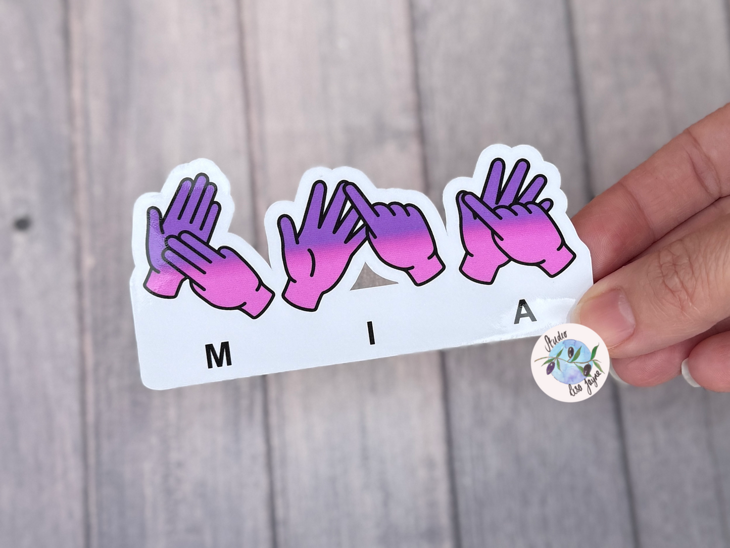 BSL name sticker spelling Mia and coloured with a pink and purple gradient