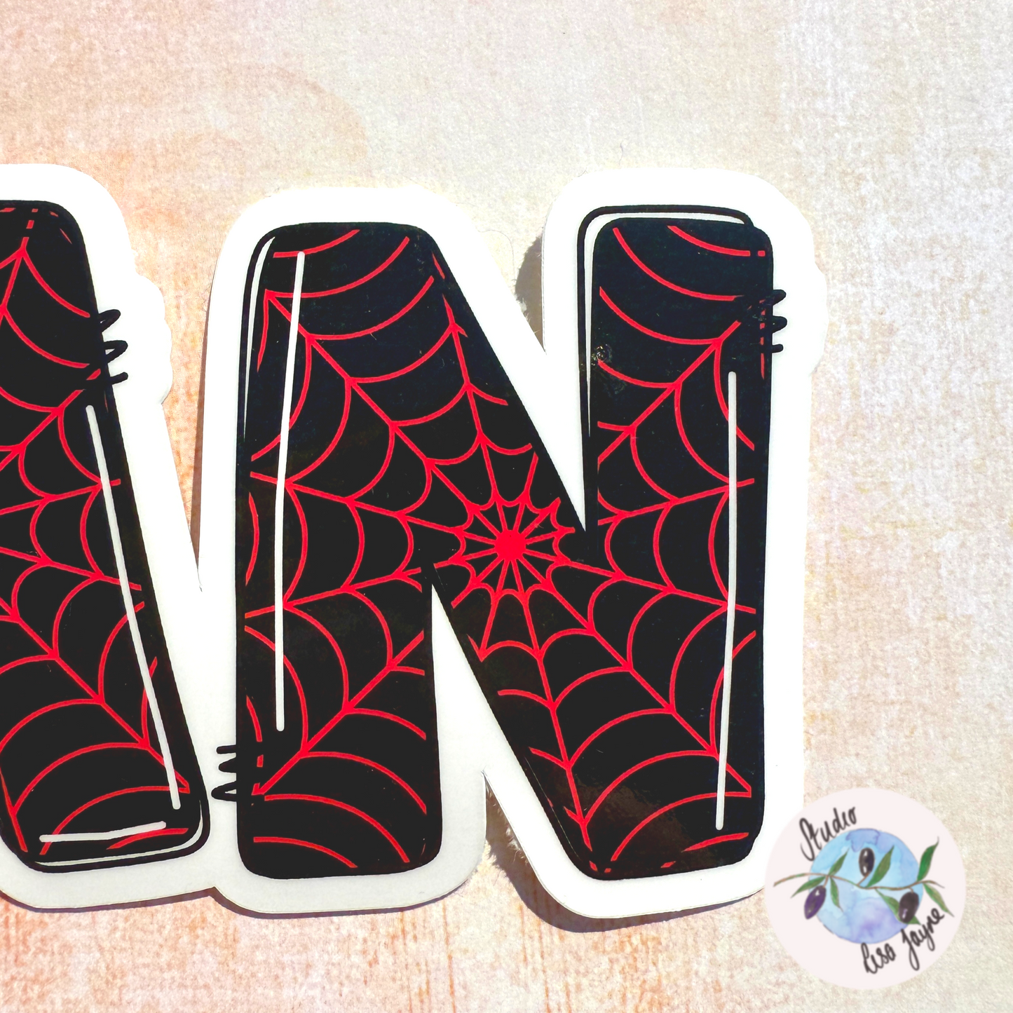 Black Spiderman Miles Morales Name Sticker Closeup