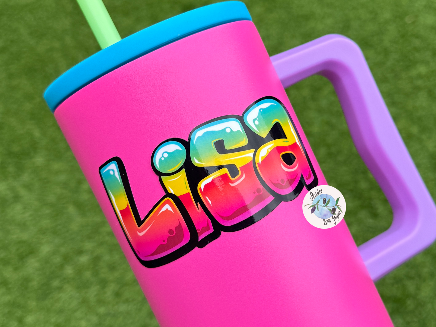 Pink tumbler with colourful 'Lisa' graffiti name sticker