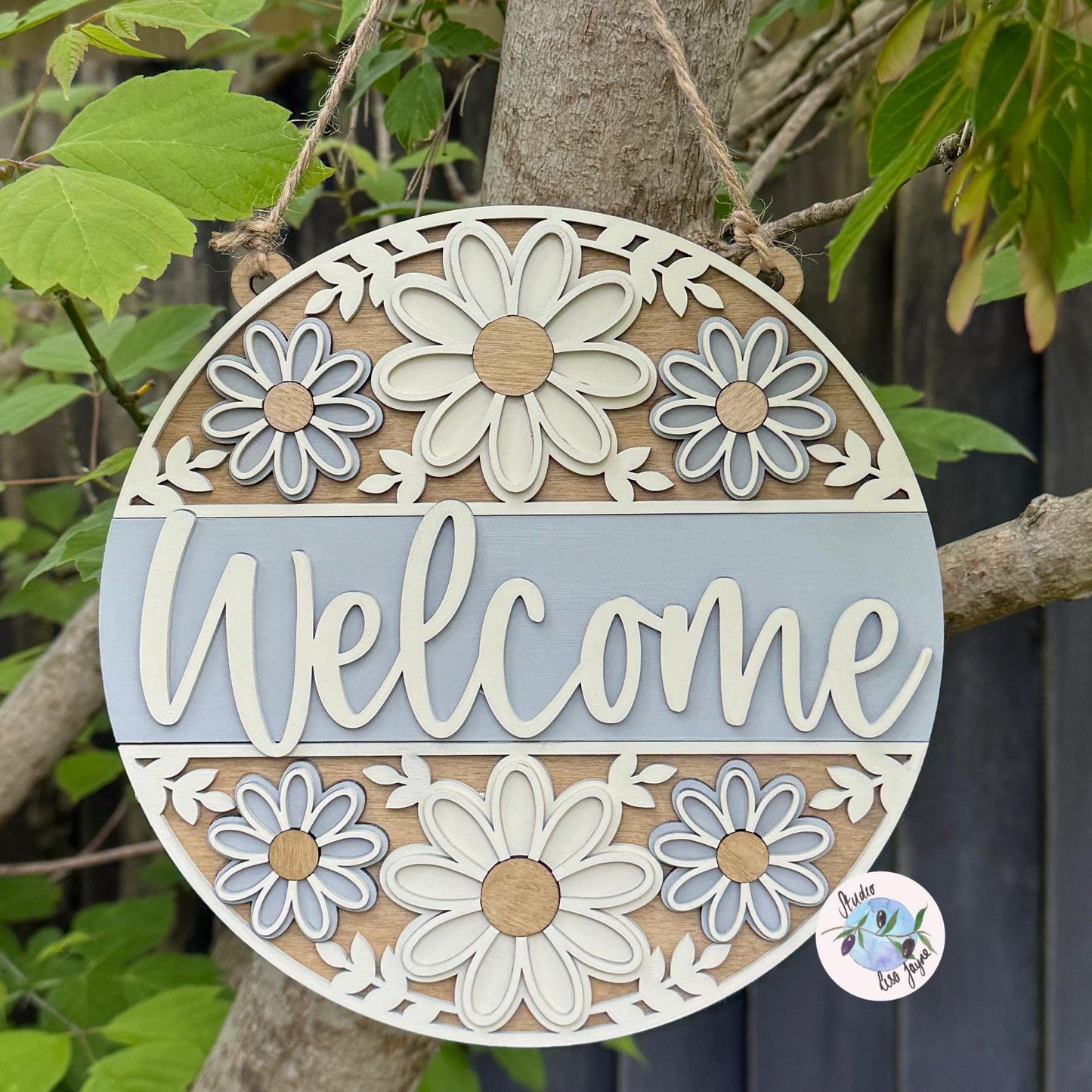 Welcome/Croeso Floral Handmade Hanging Wooden Sign - cream and grey/gray chalk paint flowers with wood stained accents. Hanging in nature