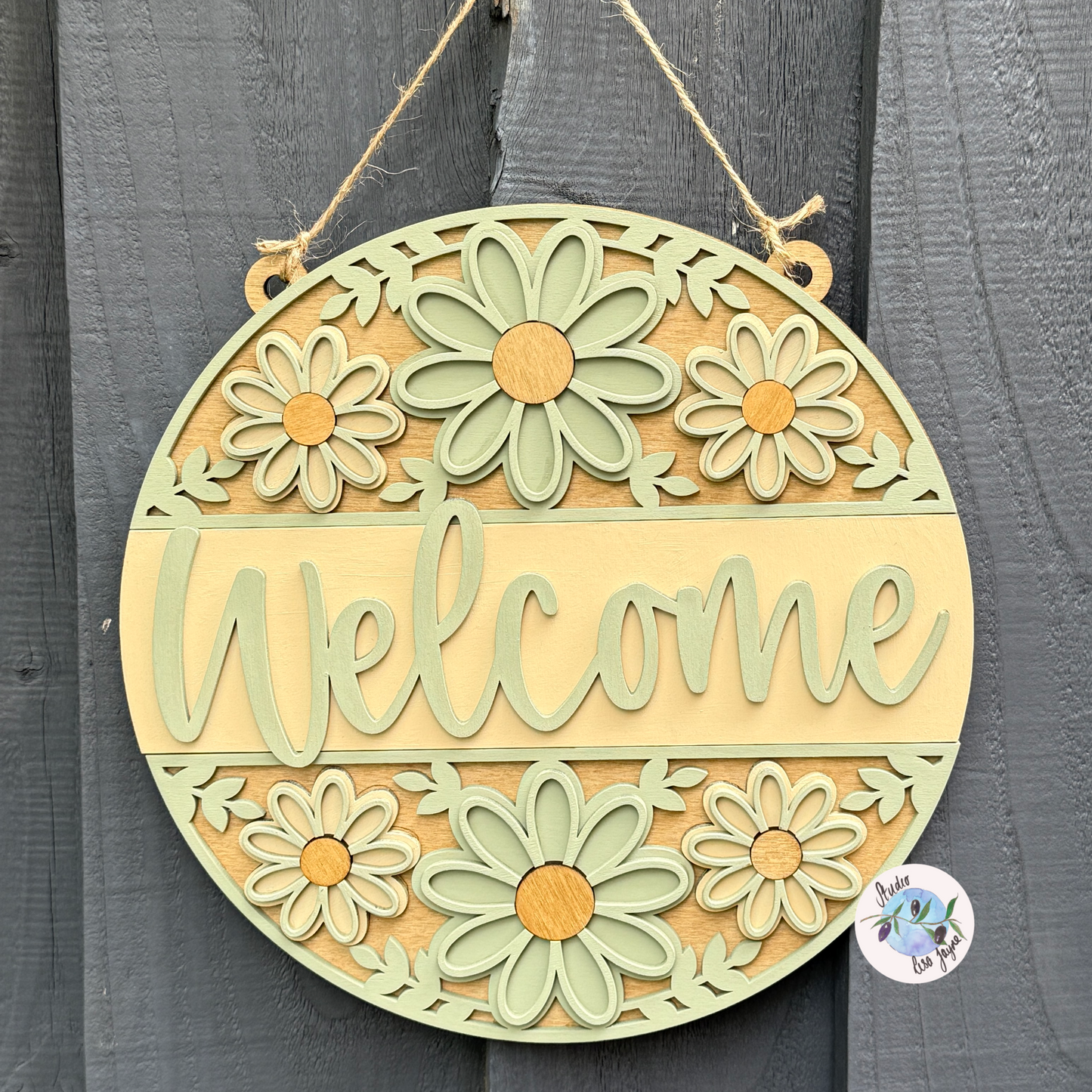 Welcome/Croeso Floral Handmade Hanging Wooden Sign - cream and green chalk paint flowers with wood stained accents hanging on a simple grey background