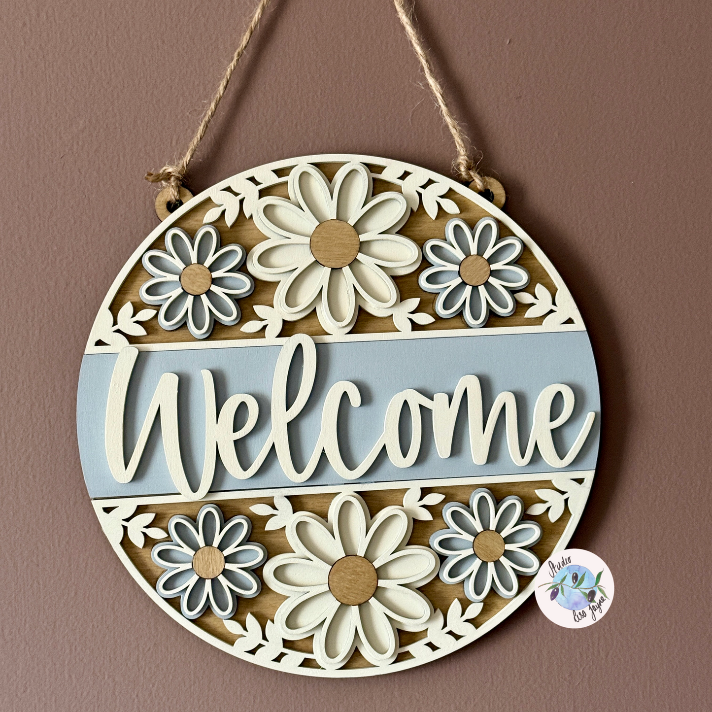 Welcome/Croeso Floral Handmade Hanging Wooden Sign - cream and grey/gray chalk paint flowers with wood stained accents. Simple Brown wall with natural light highlighting shadows