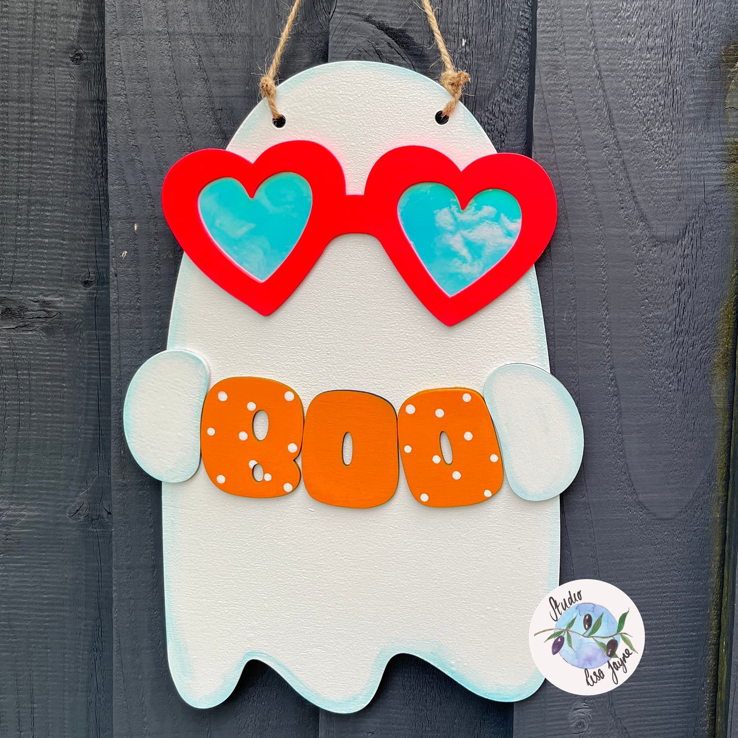 Cute kawaii ghost Halloween sign - wearing reflective glasses and holding a boo sign - close up