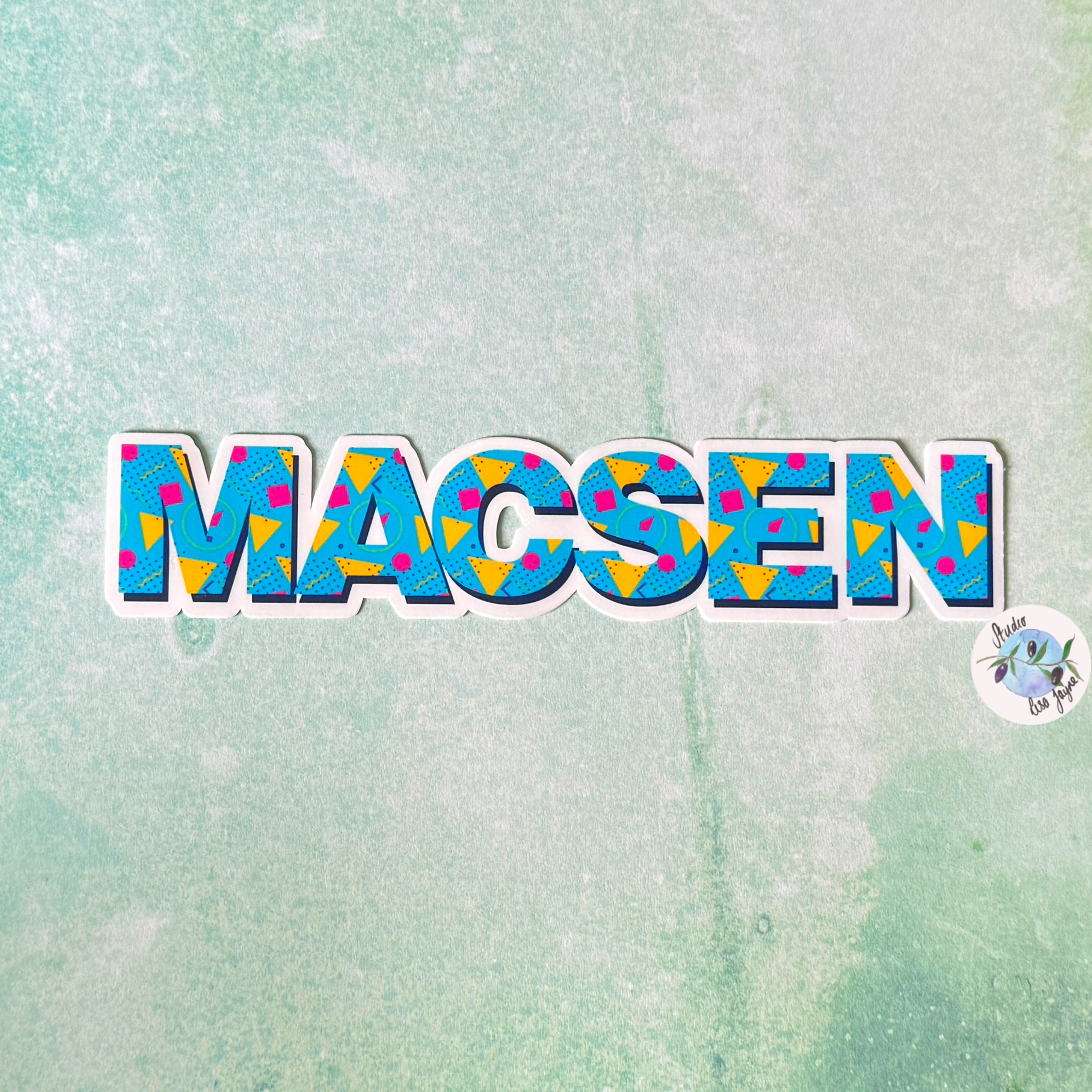 80s Style Personalised Waterproof Vinyl Name Sticker Patterned Geometric Retro Closeup on Macsen name label