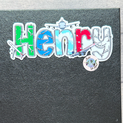 Black notebook with a col/orful Aeroplane Airplane 'Henry' sticker