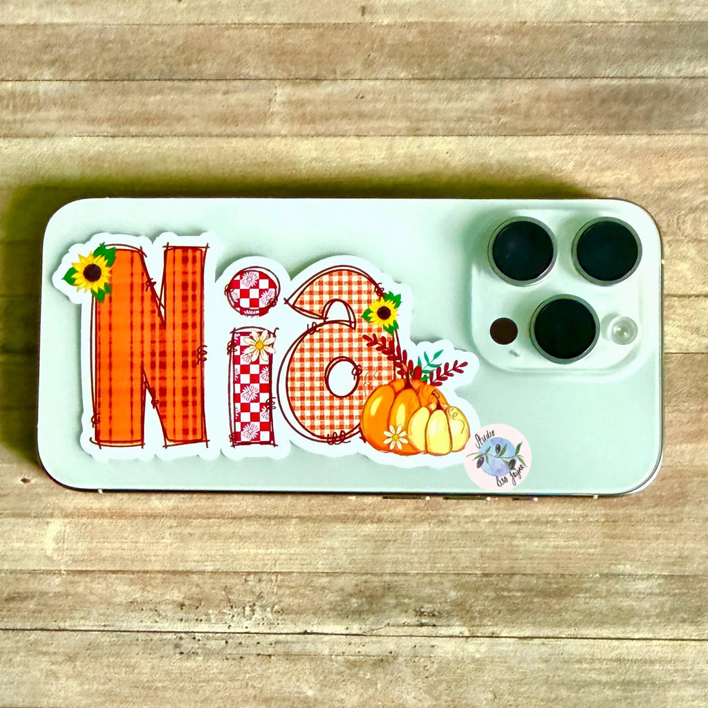 Phone case with decorative Autumn stickers on a wooden surface
