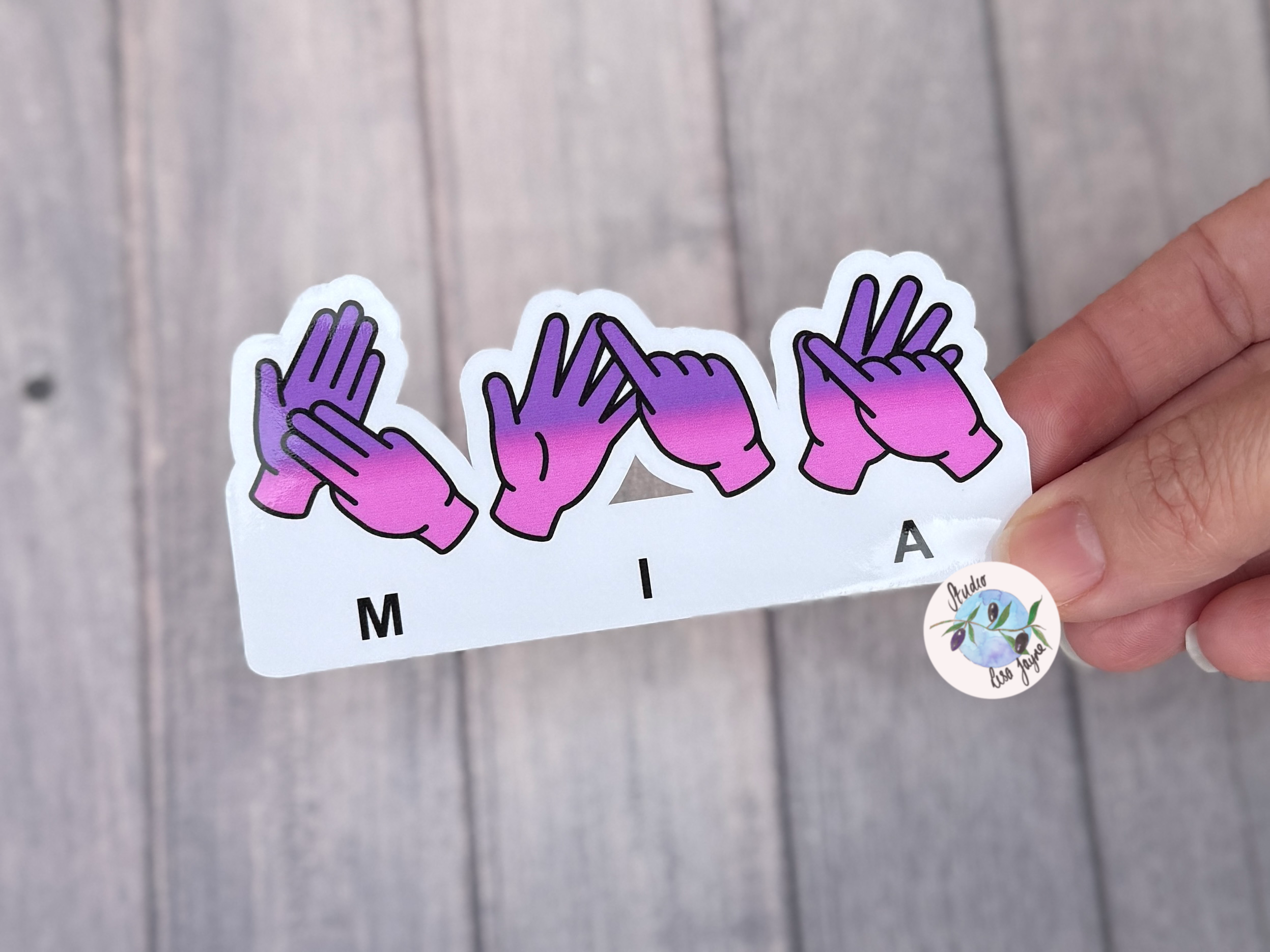 BSL name sticker spelling Mia and coloured with a pink and purple gradient