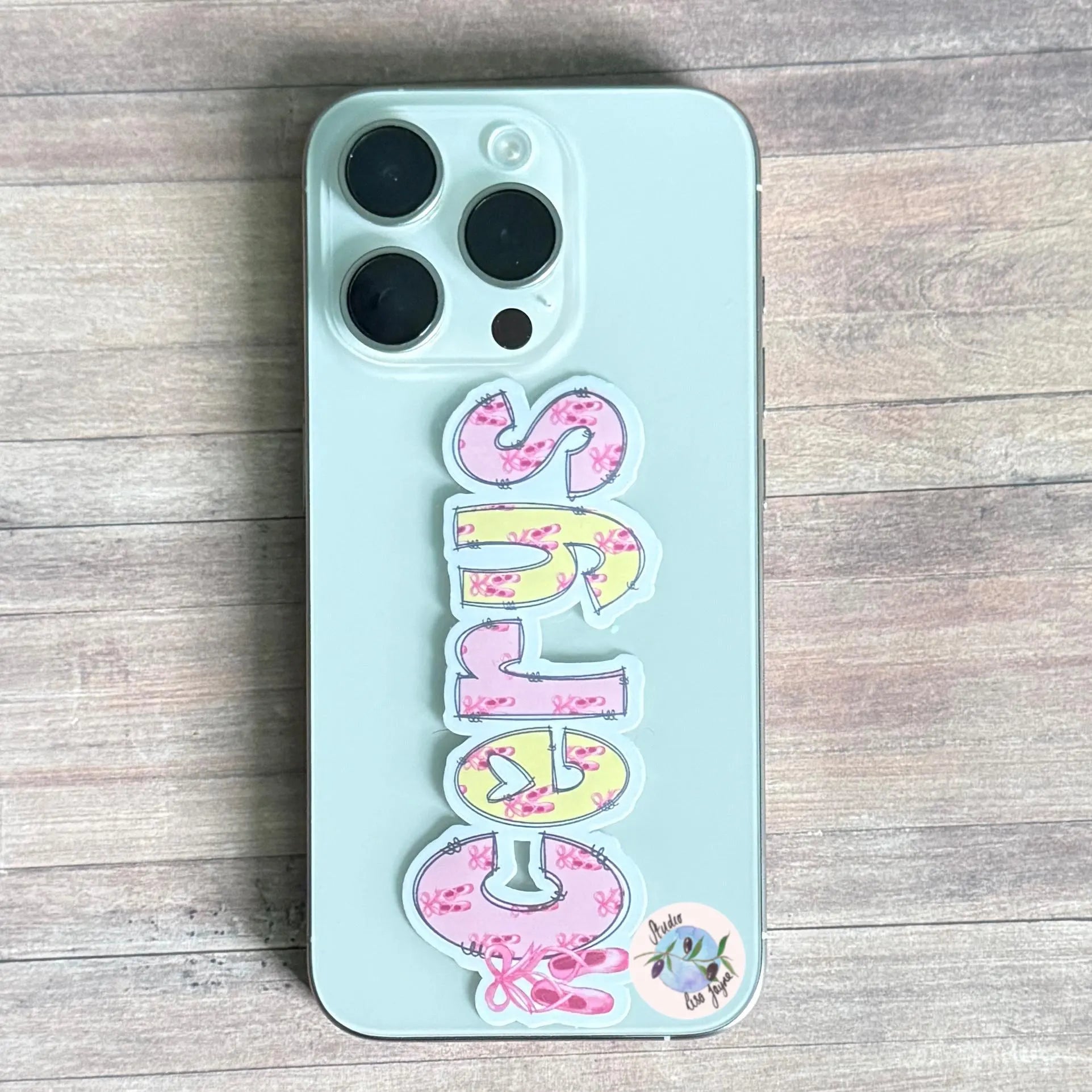 Phone with colorful name sticker design witha pink, yellow ballet theme