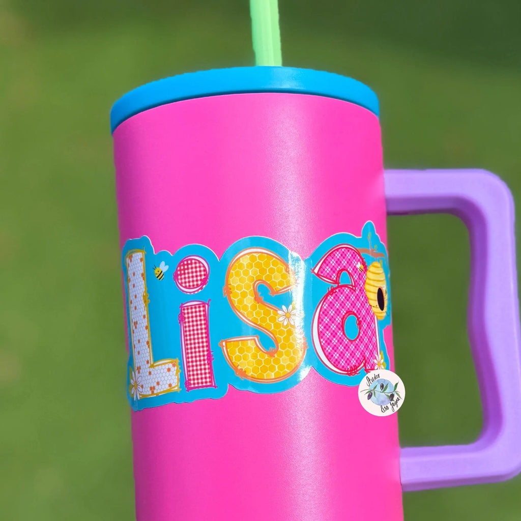 Pink tumbler with colorful name 'Lisa' and purple handle.  Sticker themed around Picnic, bees and summer time