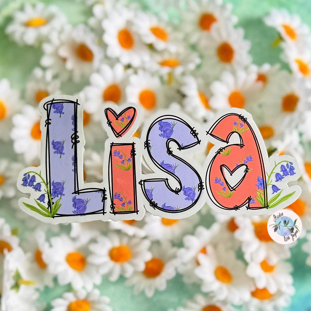 Colorful 'LISA' name sticker with floral Bluebell designs on a floral background.  Purple and Orange