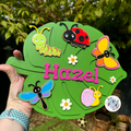 Bugs Children’s Bedroom Hand Painted Name Plaque in a leaf shape for Hazel
