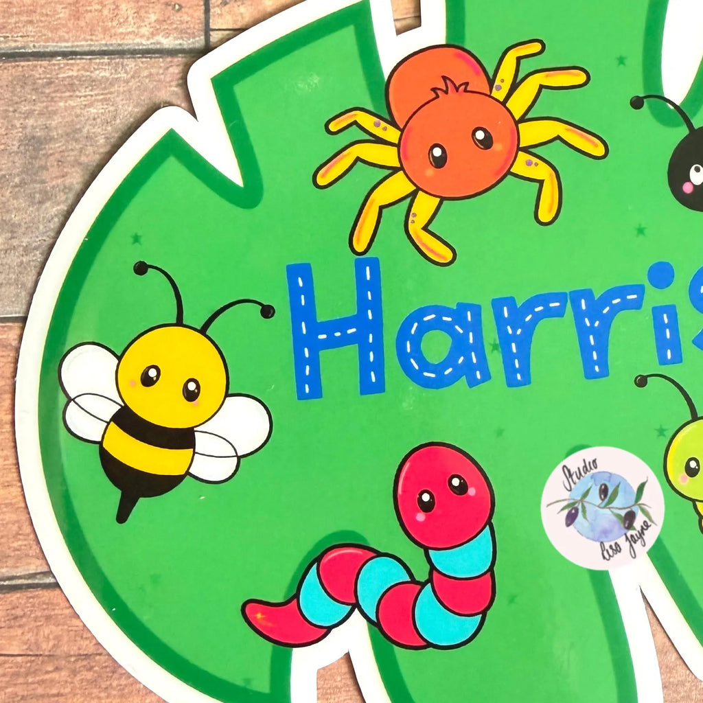Children's name decal with colorful insect illustrations and the name Harry in Blue.  Bee, spider, worm