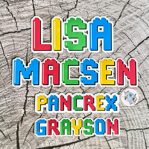 Colourful building blocks name stickers on a textured grey background