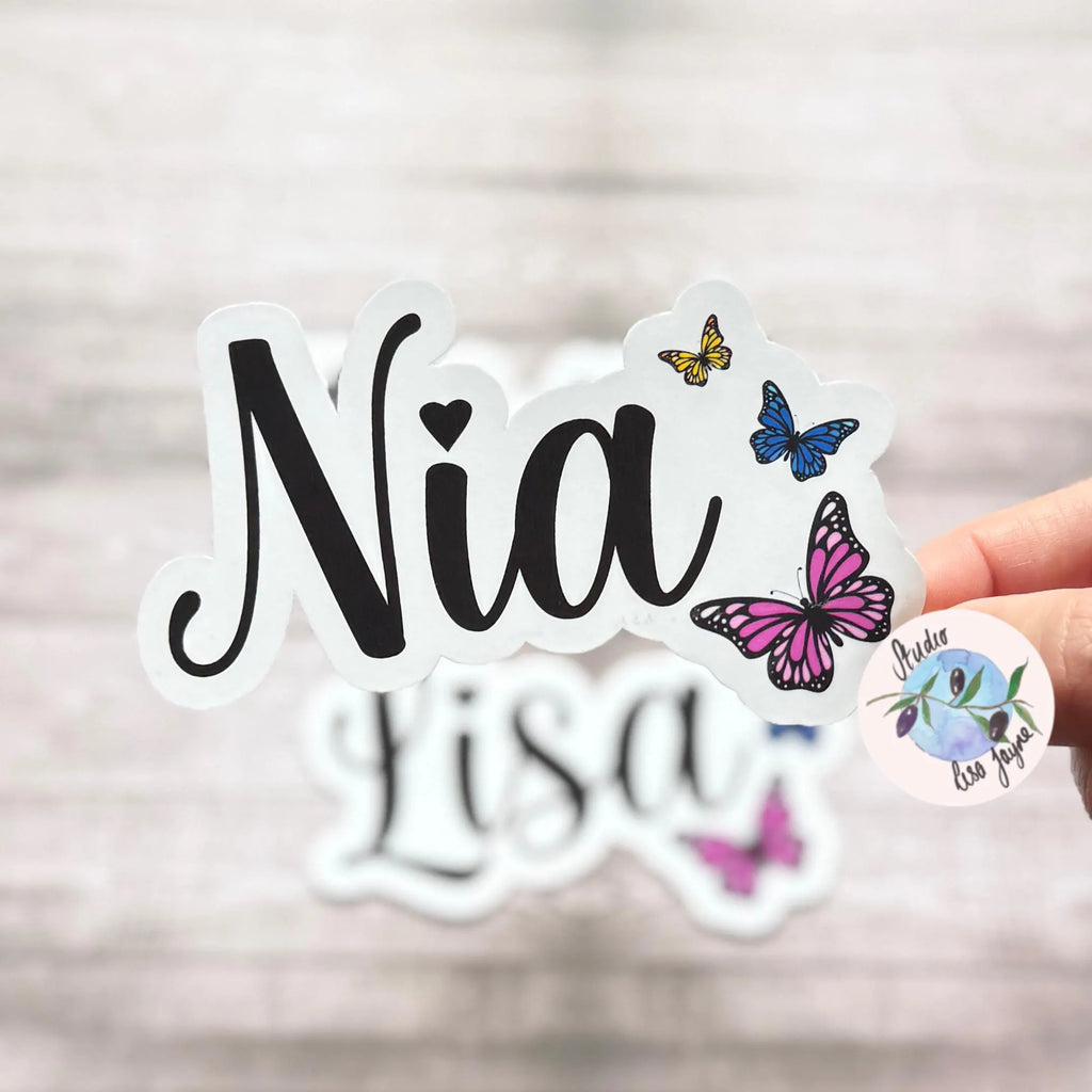 Sticker with 'Nia' text and colourful butterfly designs