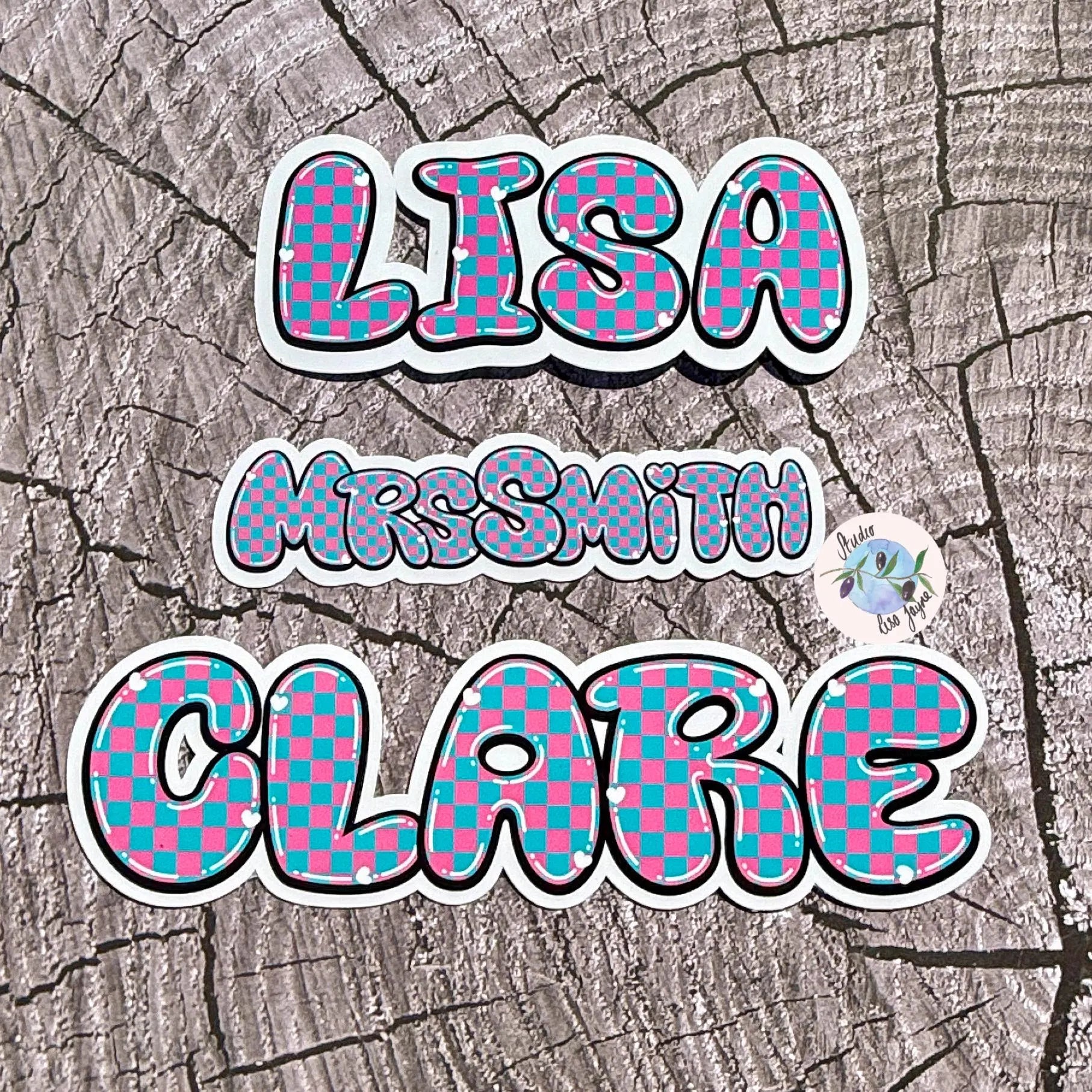 Checkered name decals on a textured surface