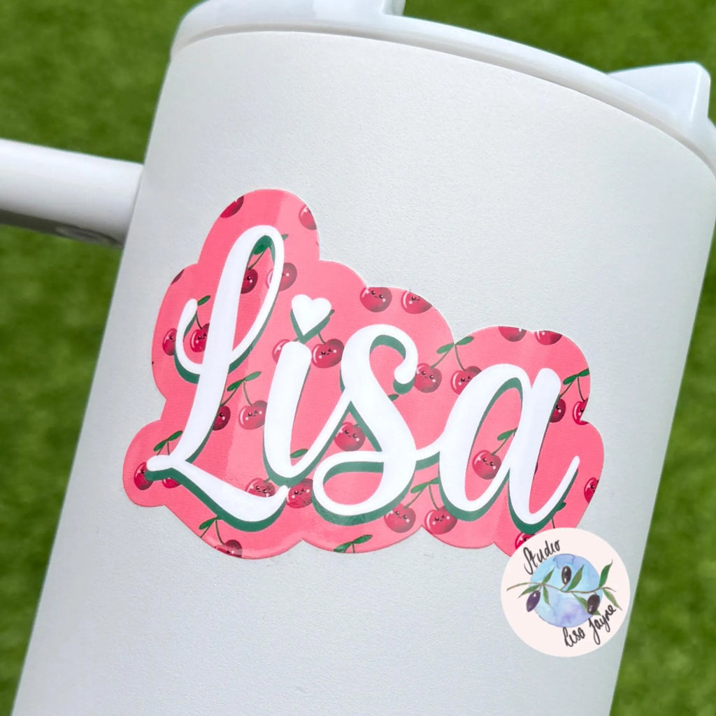 White tumbler with 'Lisa' cherry design on a green background