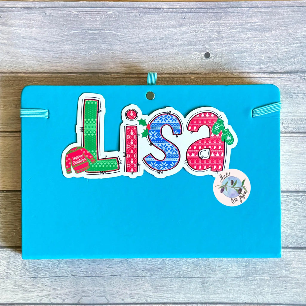 Colorful Christmas Jumper Vinyl decal with 'Lisa' on a diary, notebook, journal