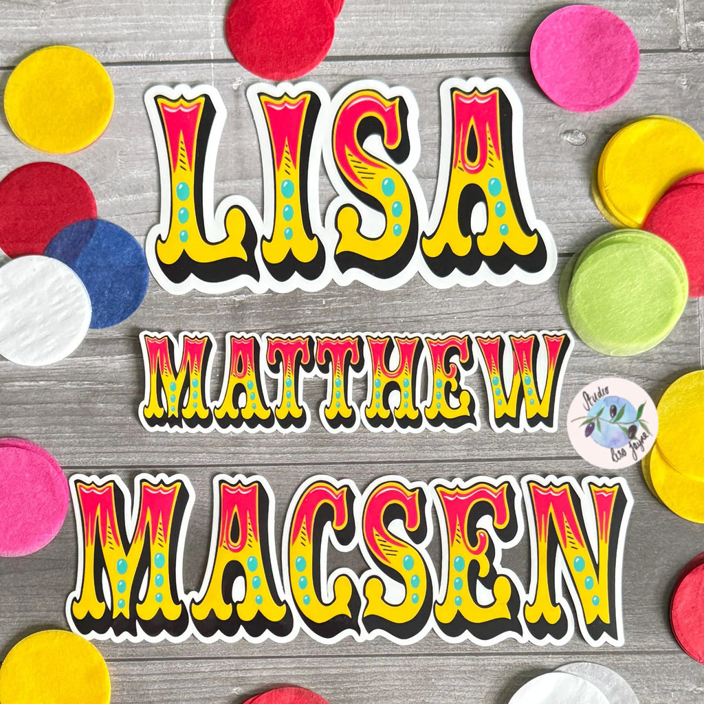 Colorful Circus name stickers (red, yellow, turquoise) on a wooden surface with colorful circles around