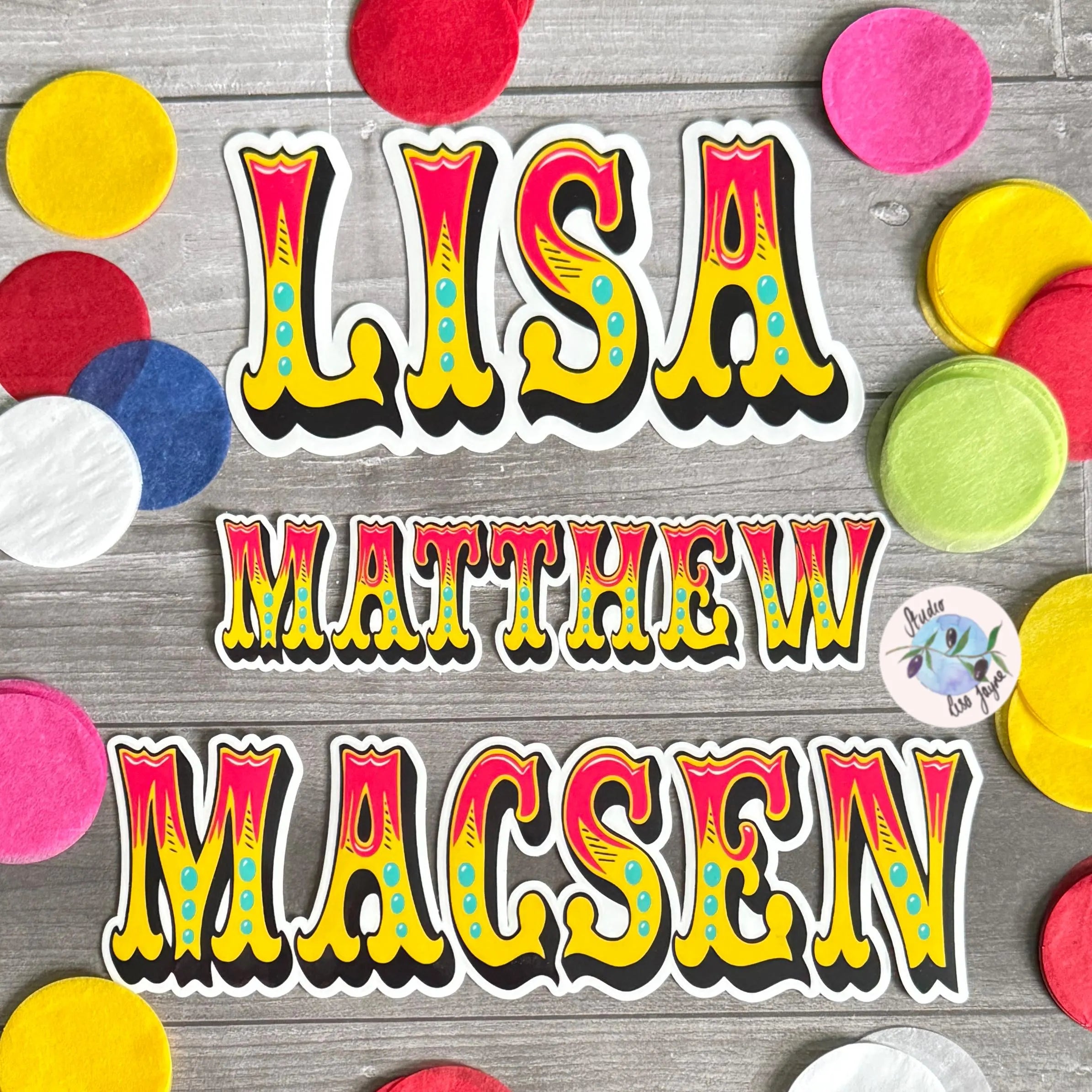 Colorful Circus name stickers (red, yellow, turquoise) on a wooden surface with colorful circles around
