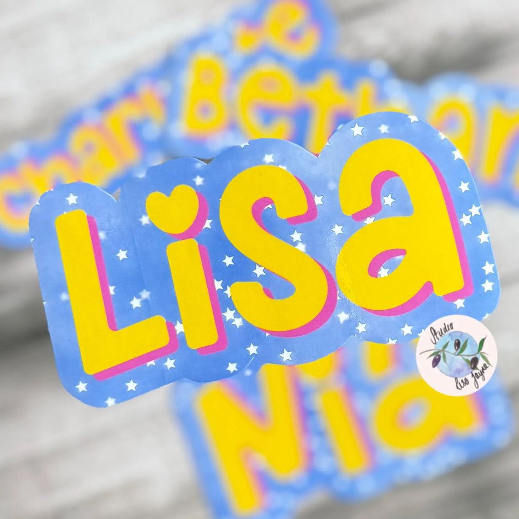 Colorful stat name stickers with 'Lisa' with blue background, start ans yellow/pink text and a heart