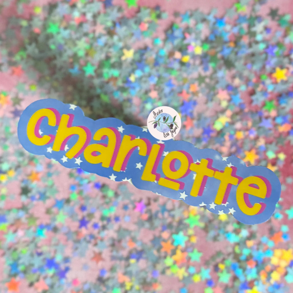Colorful 'Charlotte' text sticker with a starry background.  Yellow and pink font on a purple/blue background