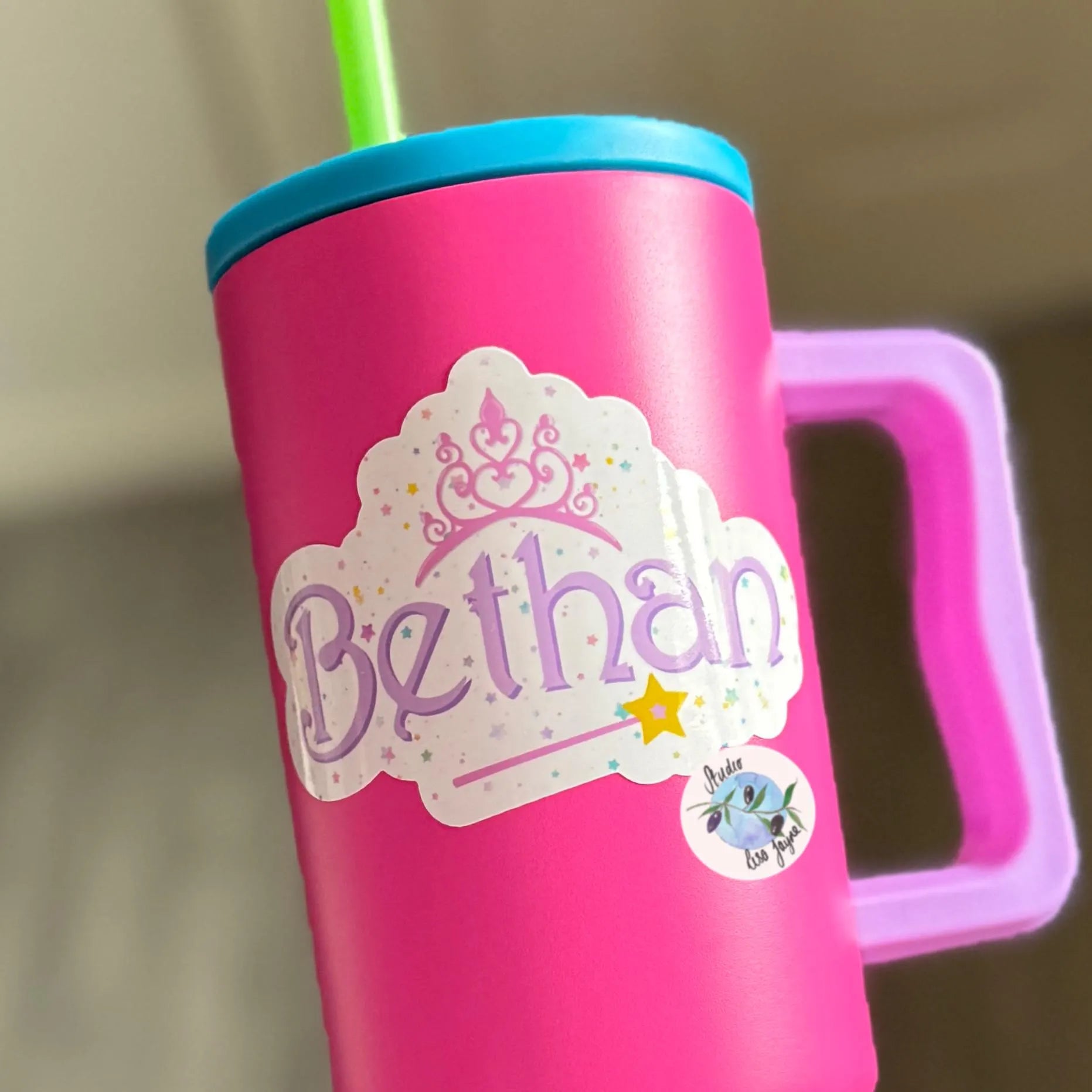 Pink tumbler featuring a 'Bethan' fairy princess sticker on a neutral background.