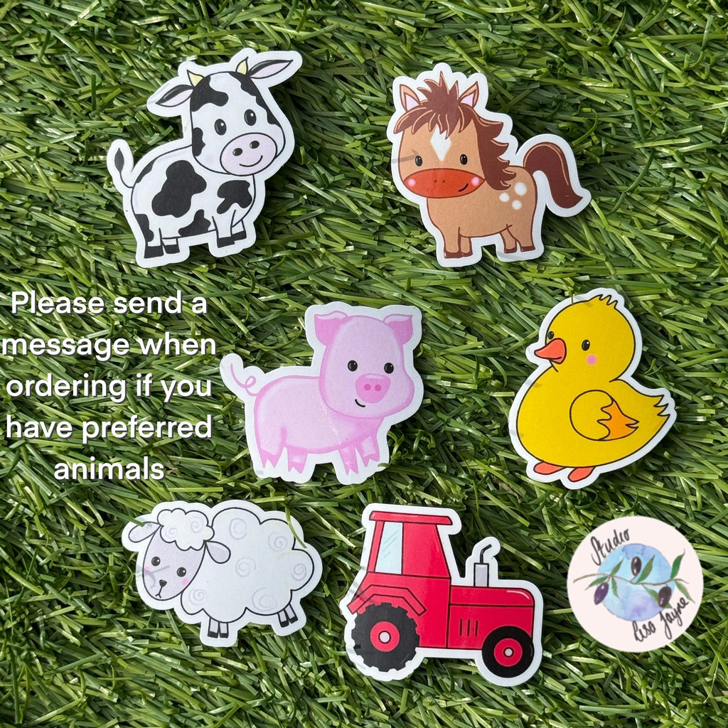 Set of animal stickers including a cow, horse, pig, duck, sheep, and tractor on grass. 
