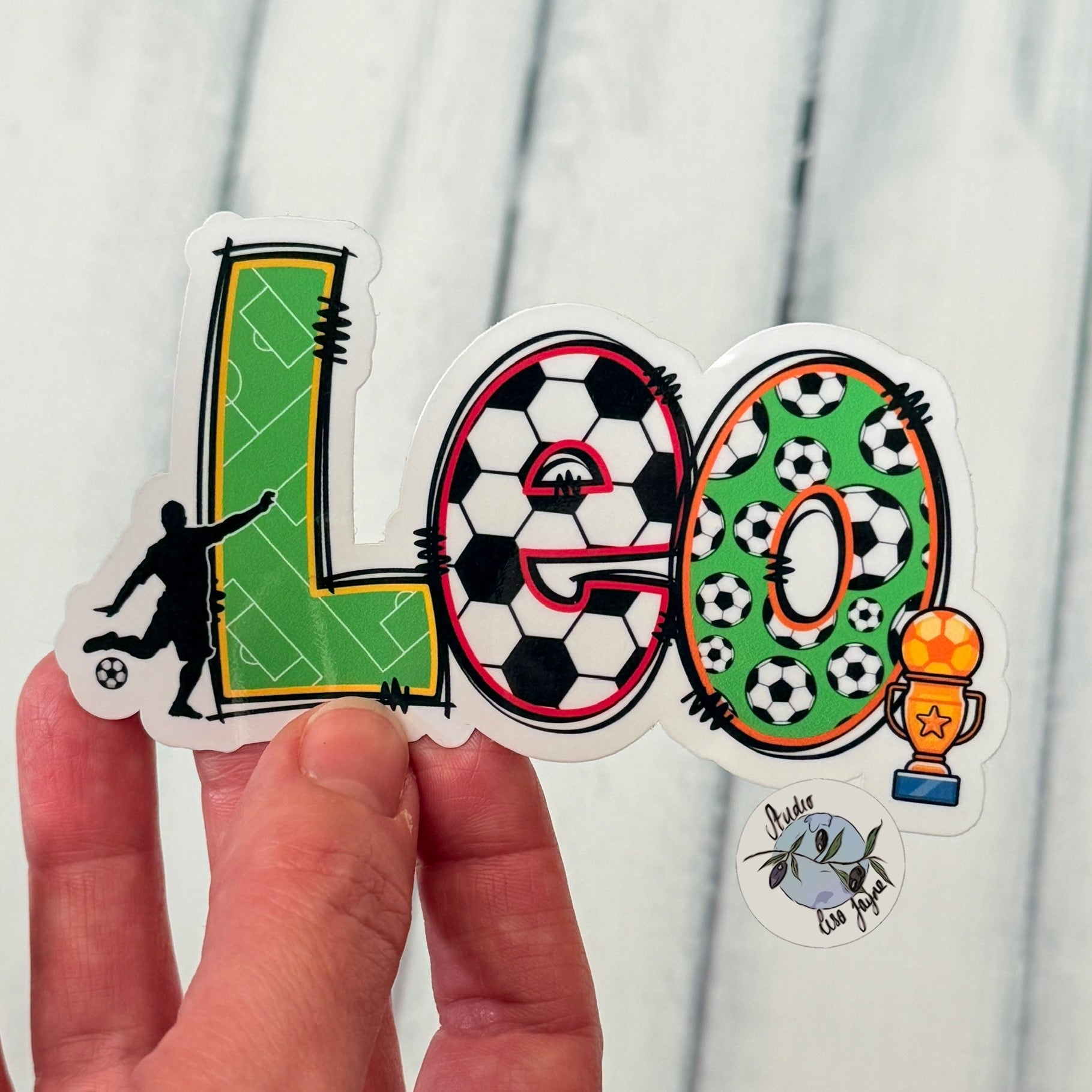 Football Name Sticker personalised, sport Name Label customised for drinks bottle, iPad, tablet, laptop.  Closeup in hand