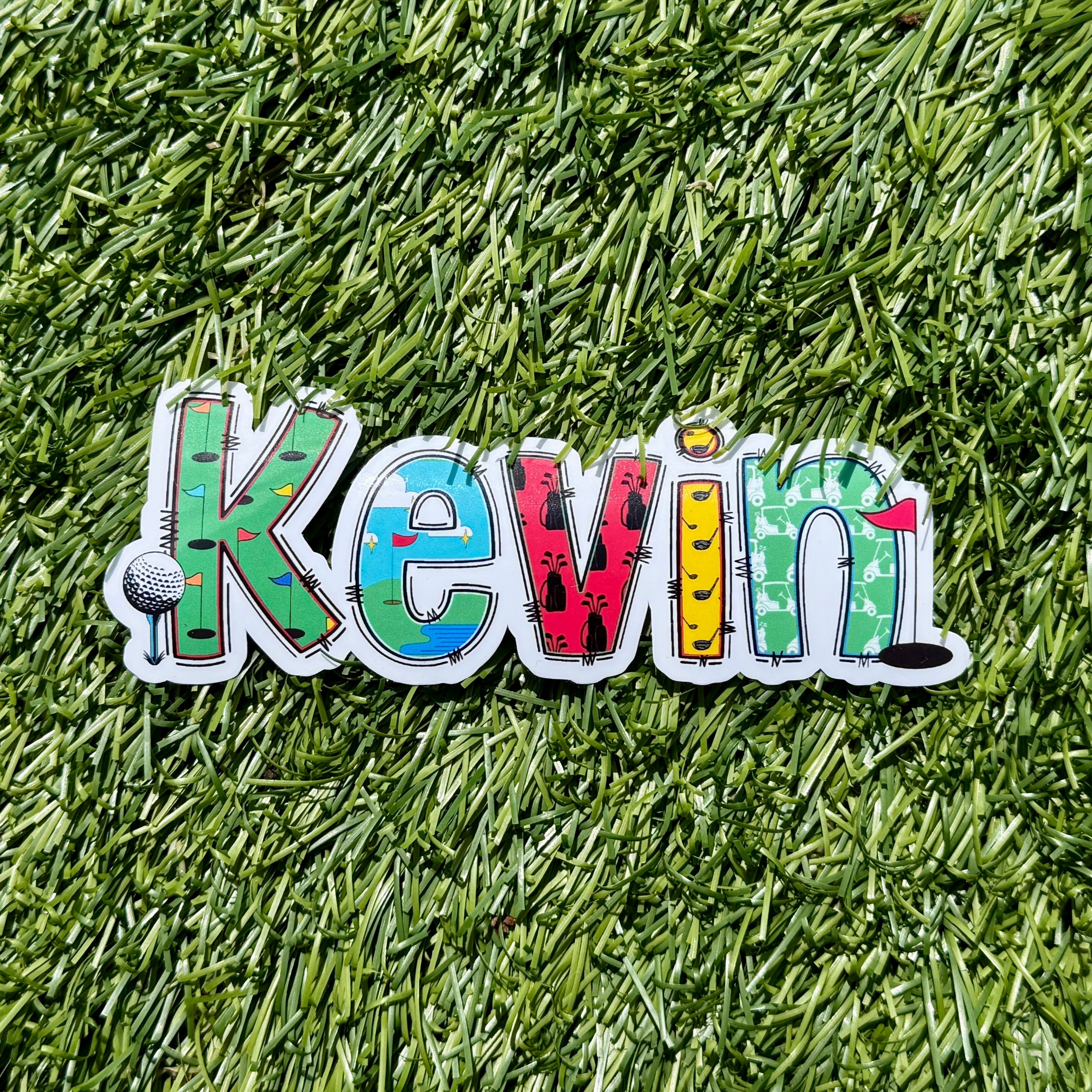 Golfing Personalised Name Sticker.  Ideal to apply to drink water bottles, notebooks, laptops and tablets.  Kevin Name Decal laid upon golf green