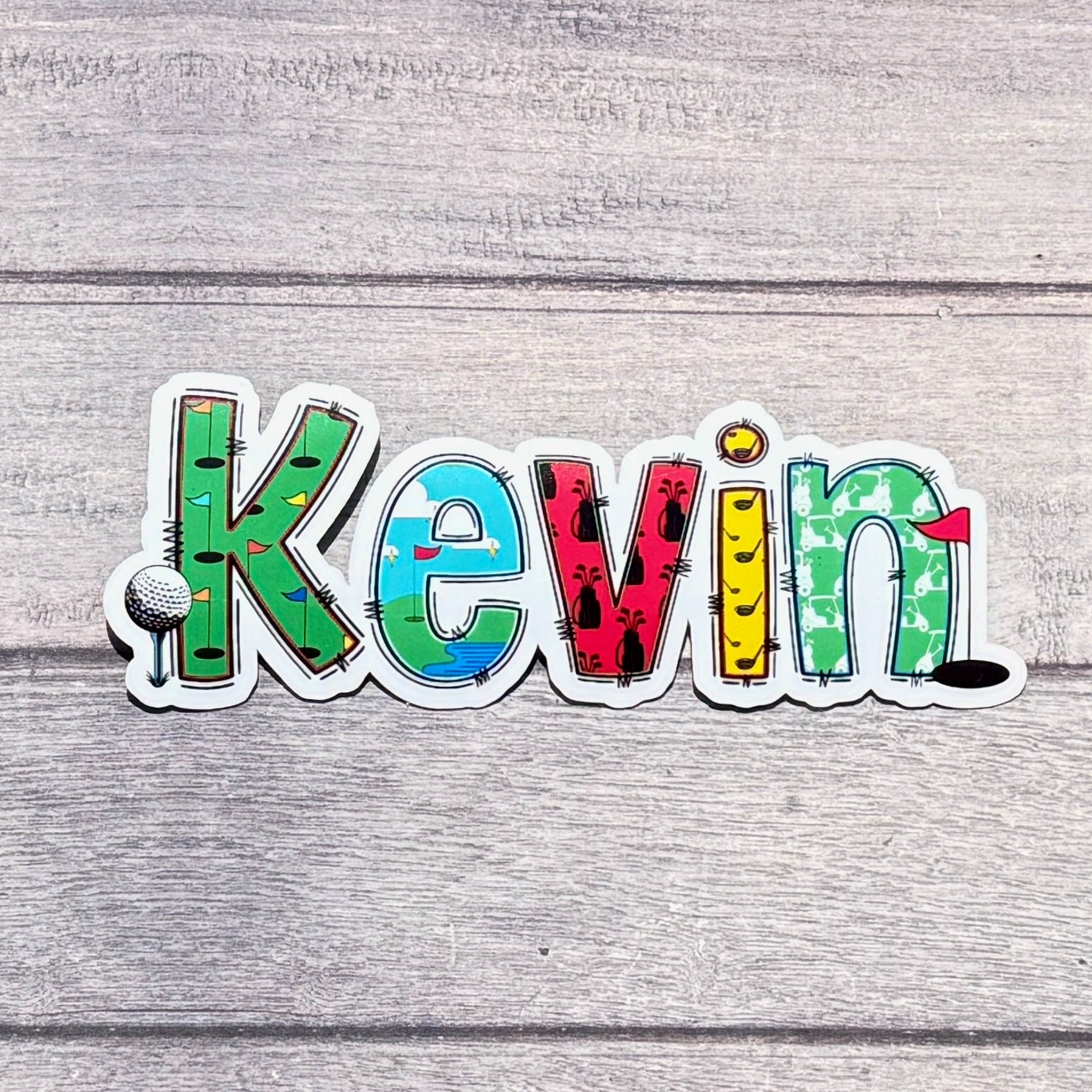 Golf Personalised Name Sticker.  Ideal to apply to drink water bottles, notebooks, laptops and tablets.  Kevin on simple wooden backdrop