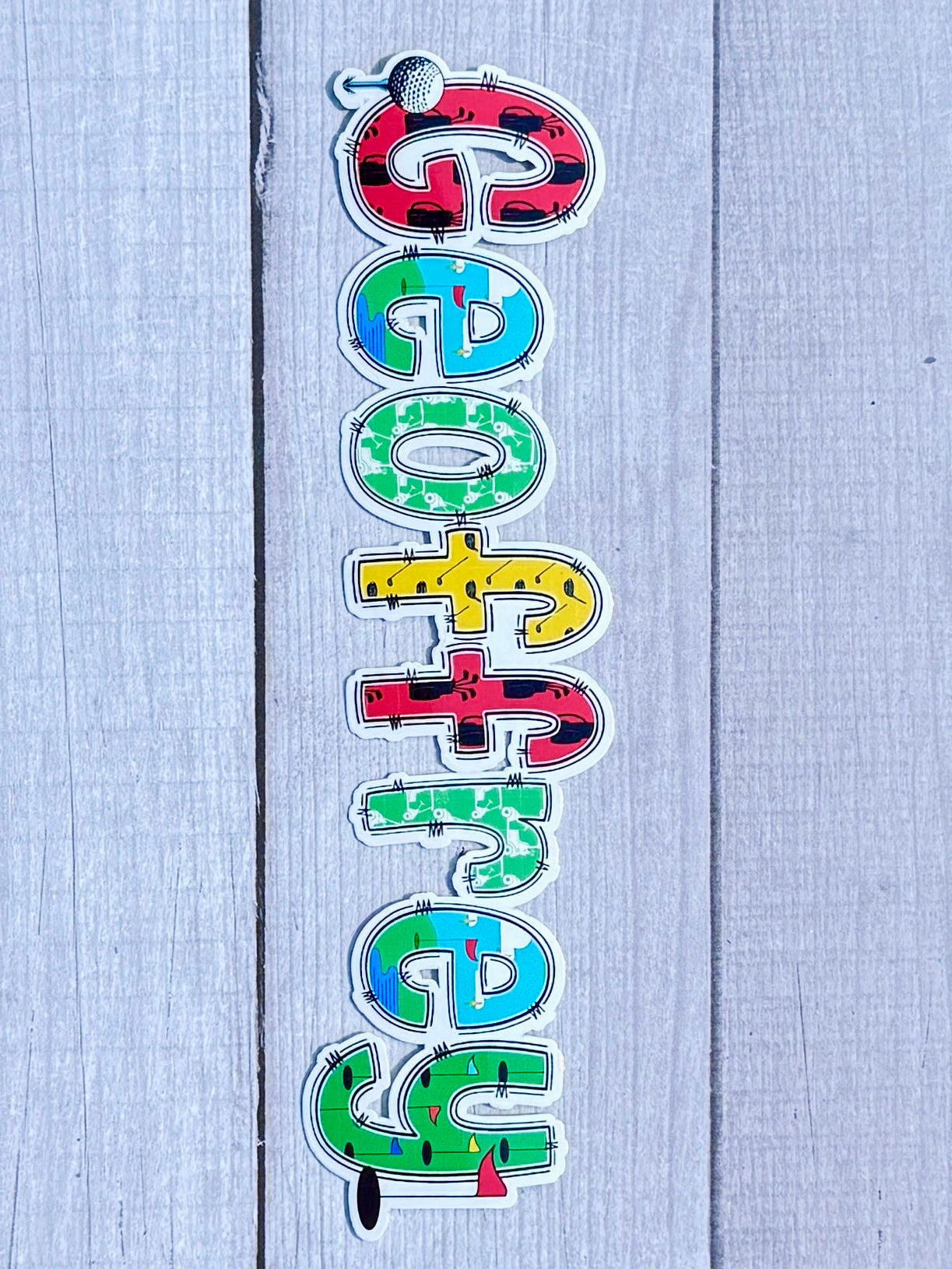 Golf Personalised Name Sticker.  Ideal to apply to drink water bottles, notebooks, laptops and tablets.  Geoffrey on wood background