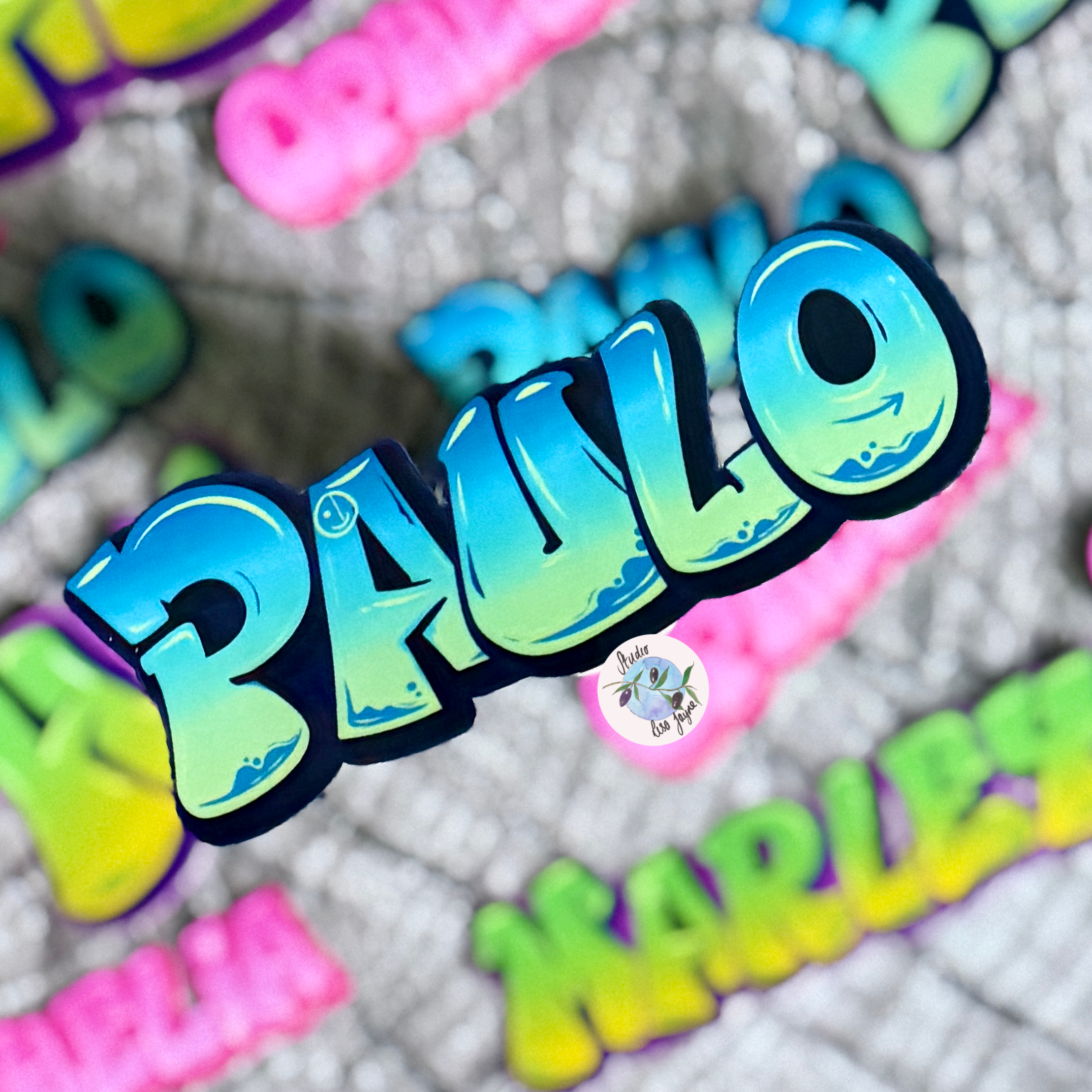 Colorful 3D graffiti name 'PAULO' sticker on a textured background with other names.  Blue, sea breeze