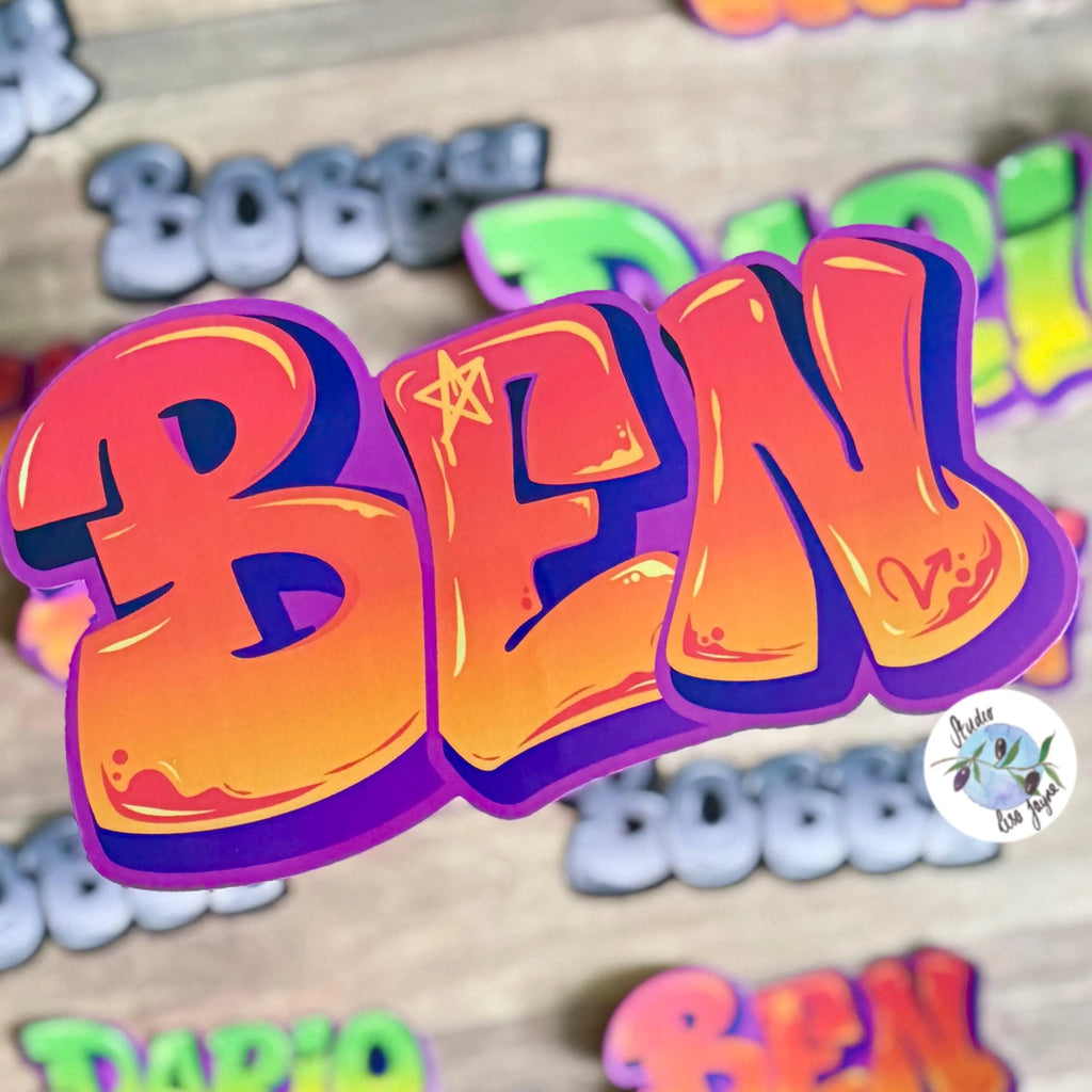 Graffiti Name Sticker in orange/purple colour.  Infront of other names in different colours as a blurred background 
