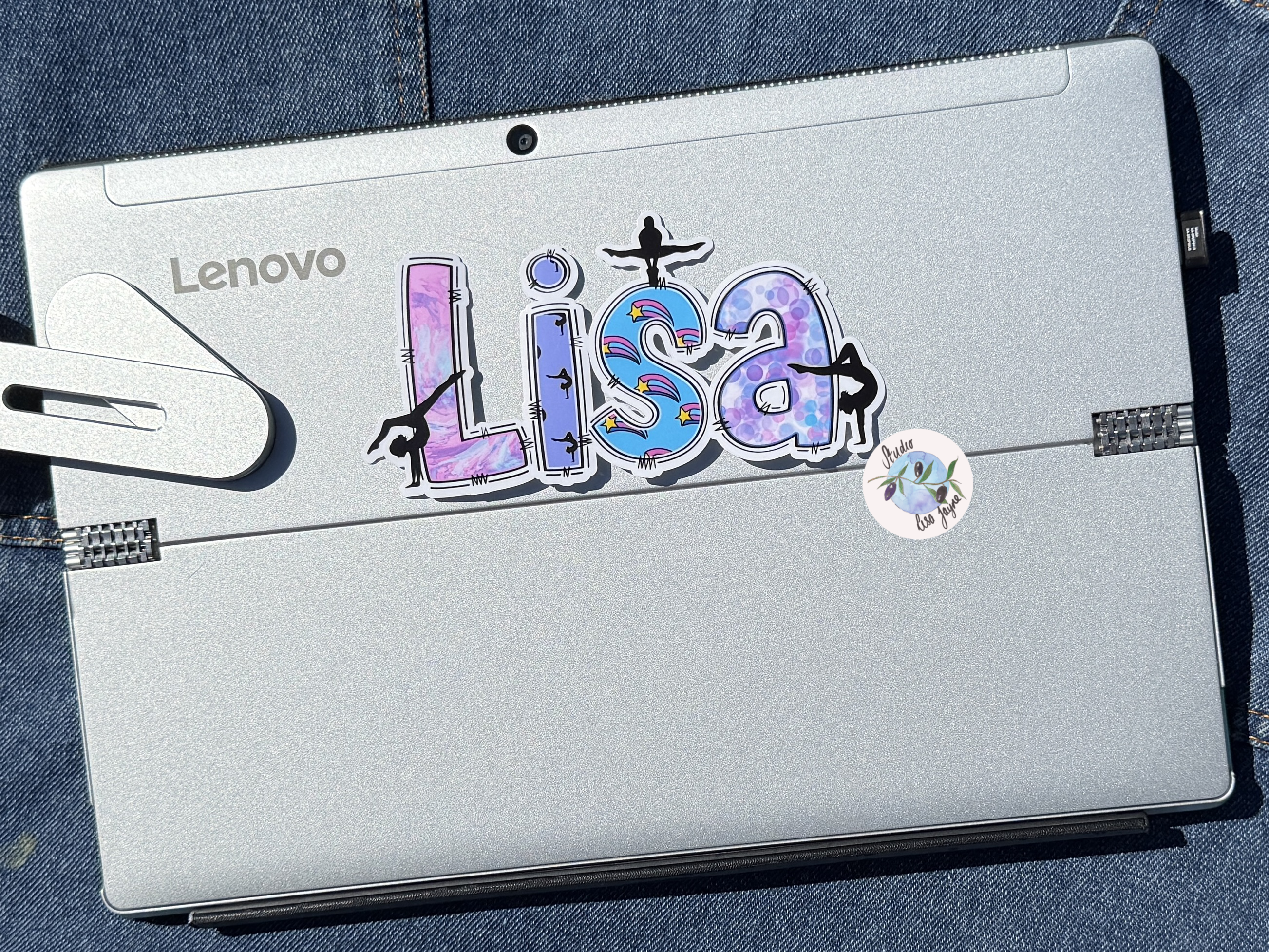 Gymnastics Name Sticker Applied to a notebook.  Waterproof personalised sports label for laptop, tablet, iPad