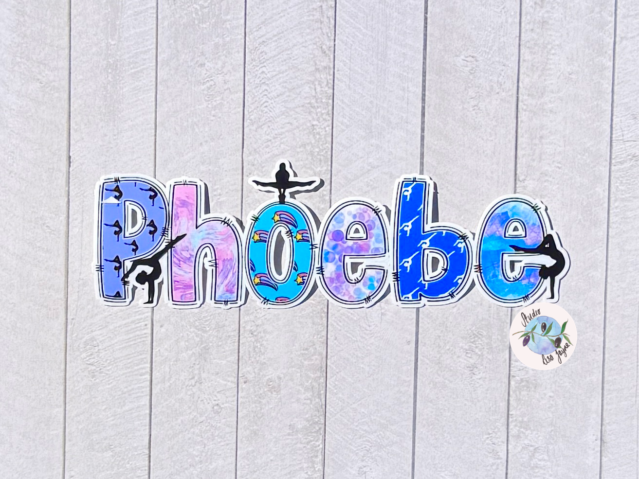 Gymnastics Name Sticker Applied to a notebook.  Waterproof personalised sports label on simple plain backdrop