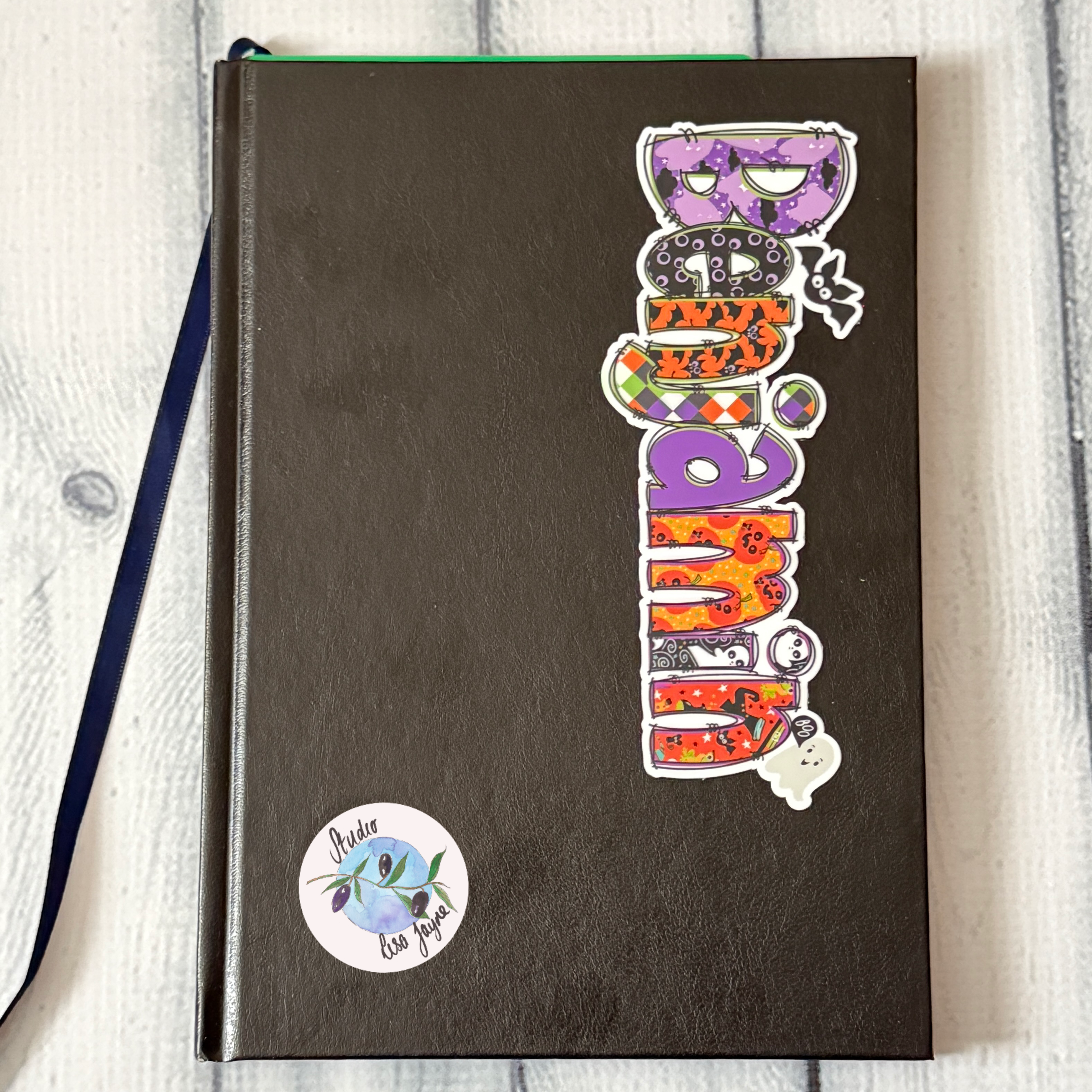 Halloween Cute Spooky Name Sticker.  Benjamin waterproof sticker applied to customise notebook