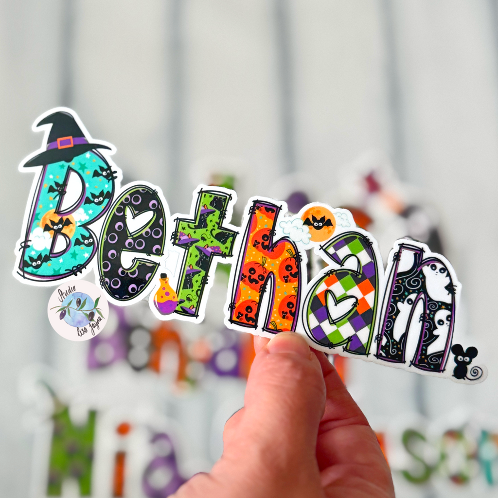 Halloween Cute Spooky Name Sticker.  Bethan waterproof sticker held in hand for scale