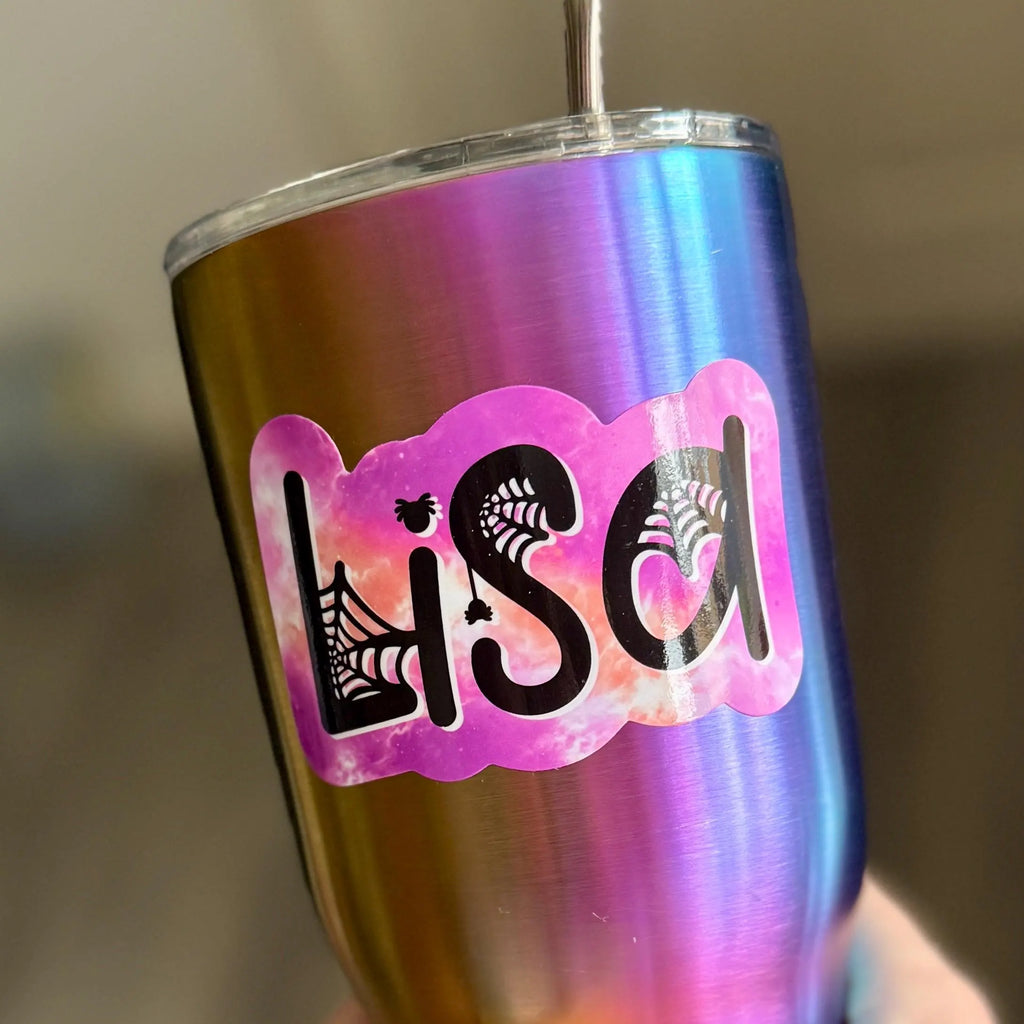 Multicolored tumbler with a pink 'Lisa' decal in pink spider halloween theme
