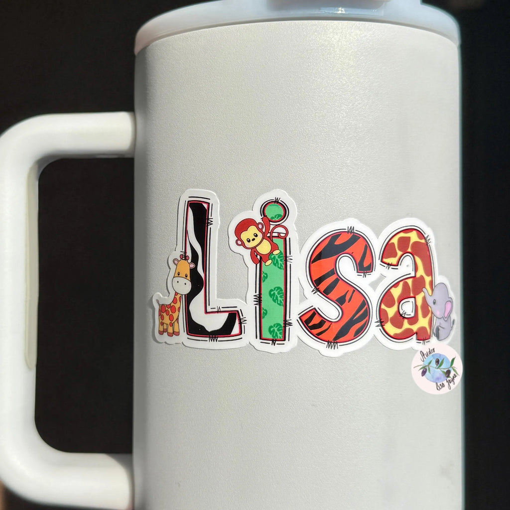 White mug with colorful 'Lisa' stickers on a black background