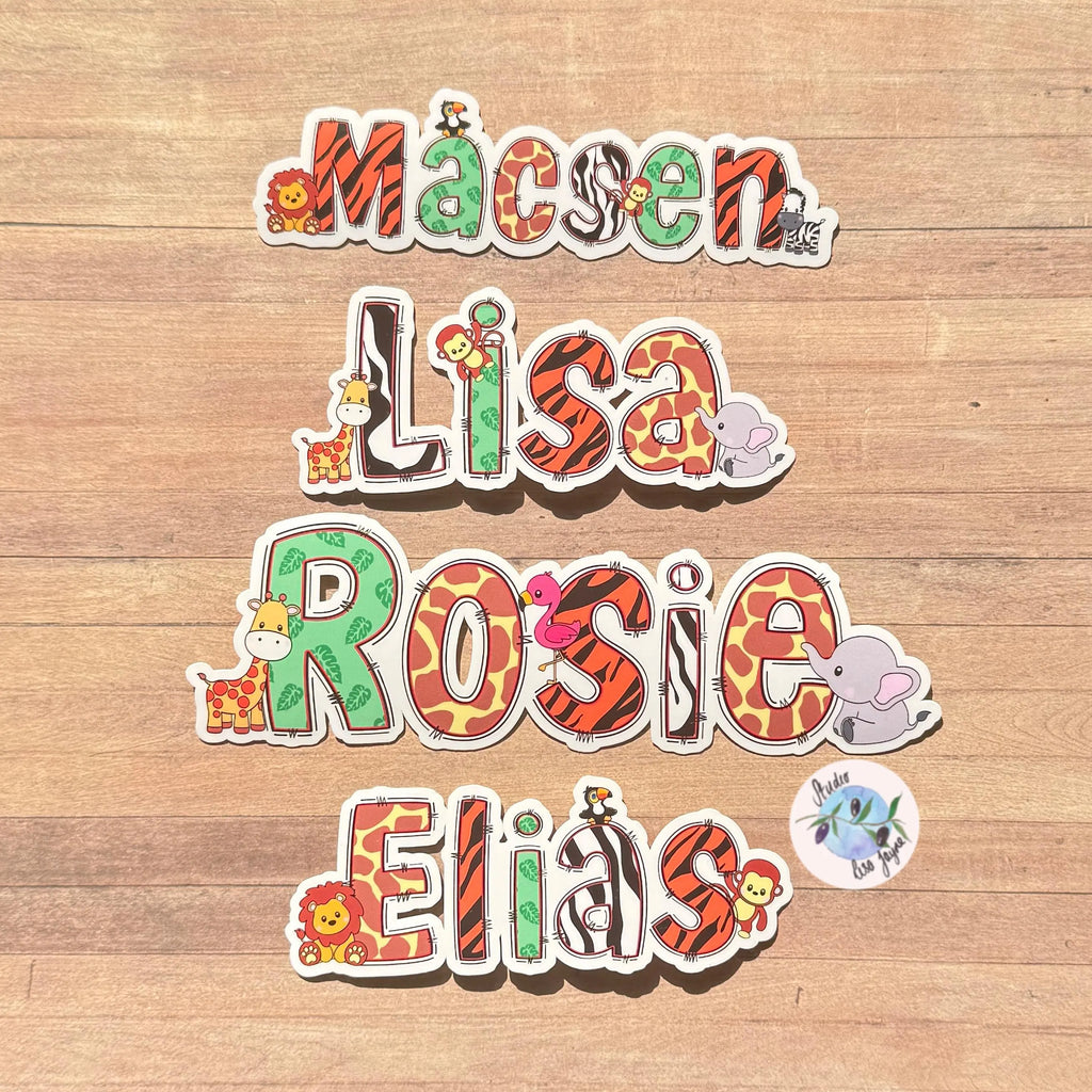 Colorful name stickers with animal designs on a zoo design sticker on a wooden background