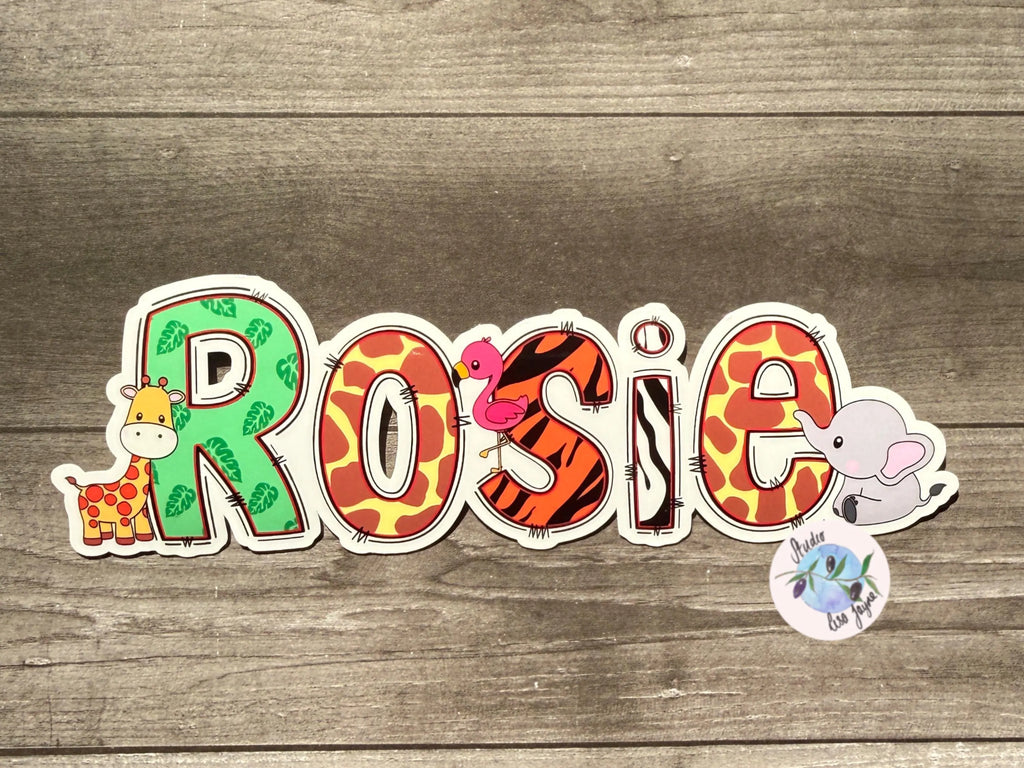 Colorful name 'Rosie' with animal-themed letters in a vinyl sticker on a wooden background