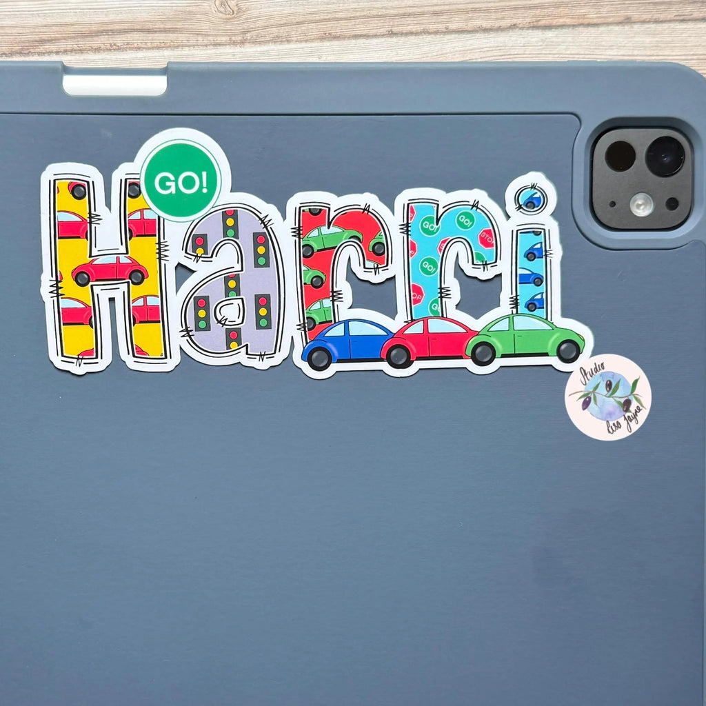 iPad tablet case with colorful 'Harri' sticker in a car theme