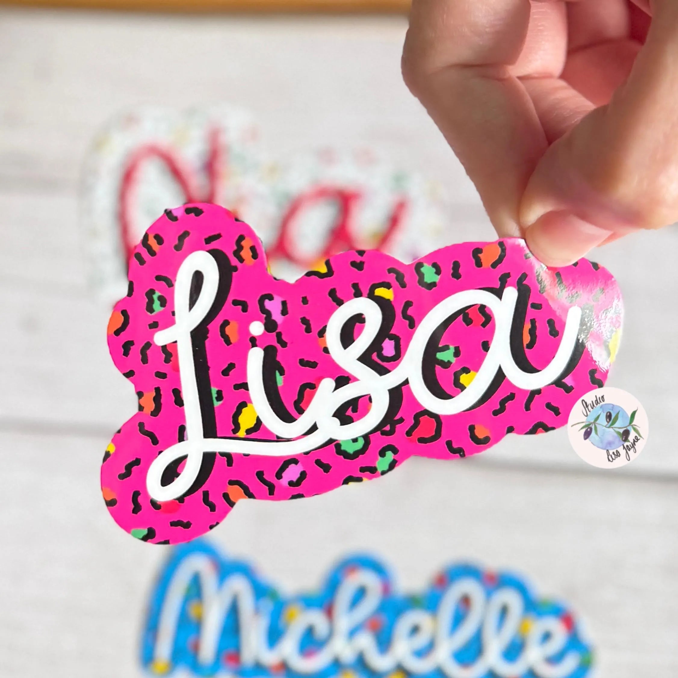 Colorful name tag with 'Lisa' on a white background