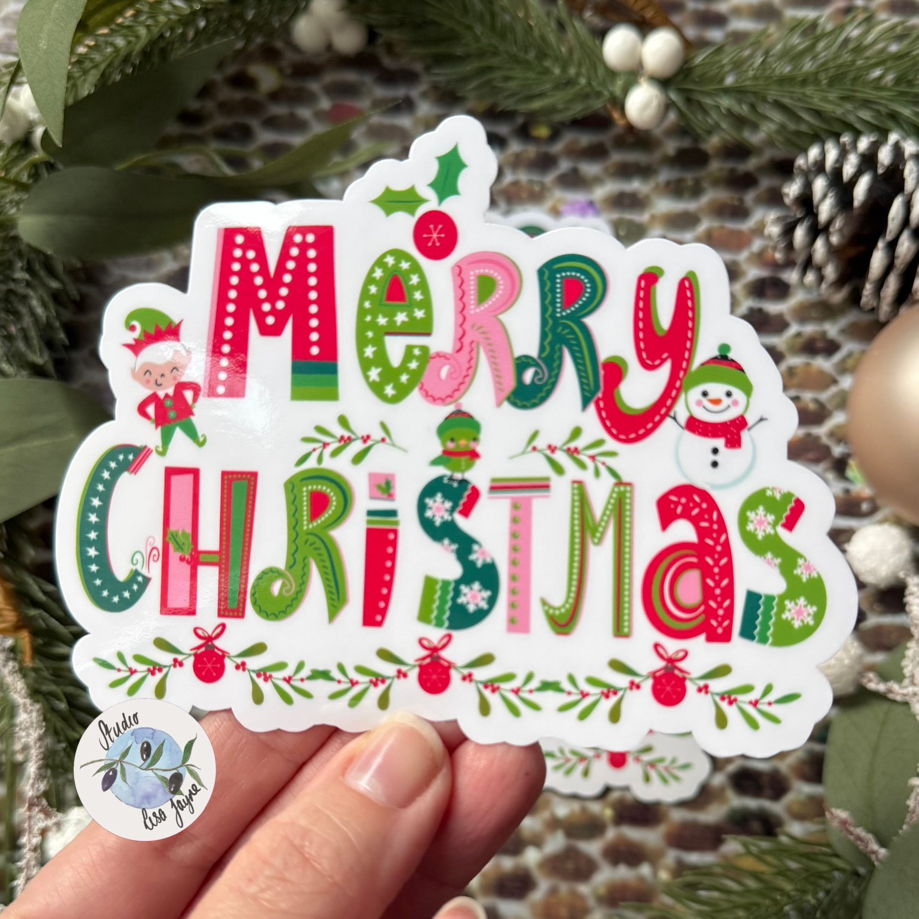 Merry Christmas Sticker - Waterproof Vinyl Decal close up in hand