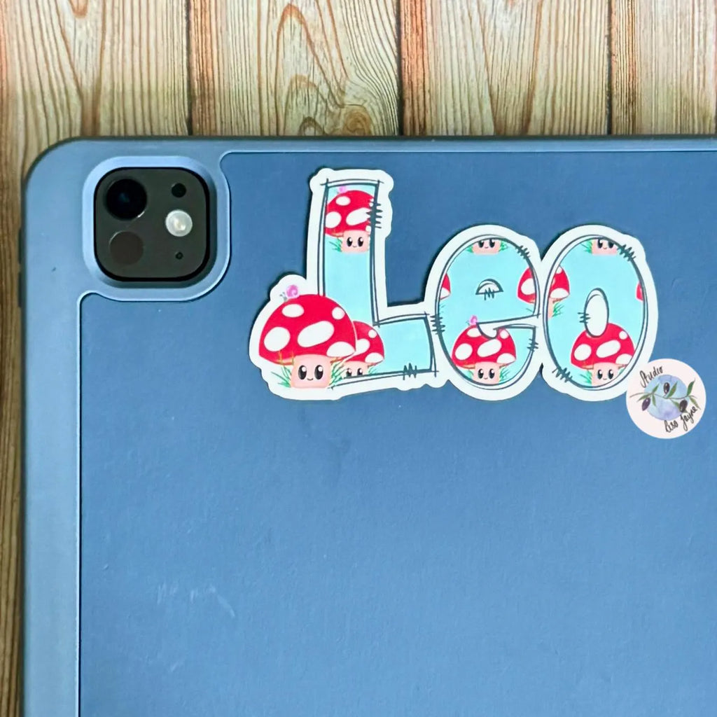 Phone case with 'LEO' design featuring cartoon mushrooms on a wooden surface