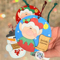 Nadolig Llawen Elf Christmas Tree Decoration Handmade Wooden Decoration Made in Wales - Red Elf on Blue Backdrop in hand