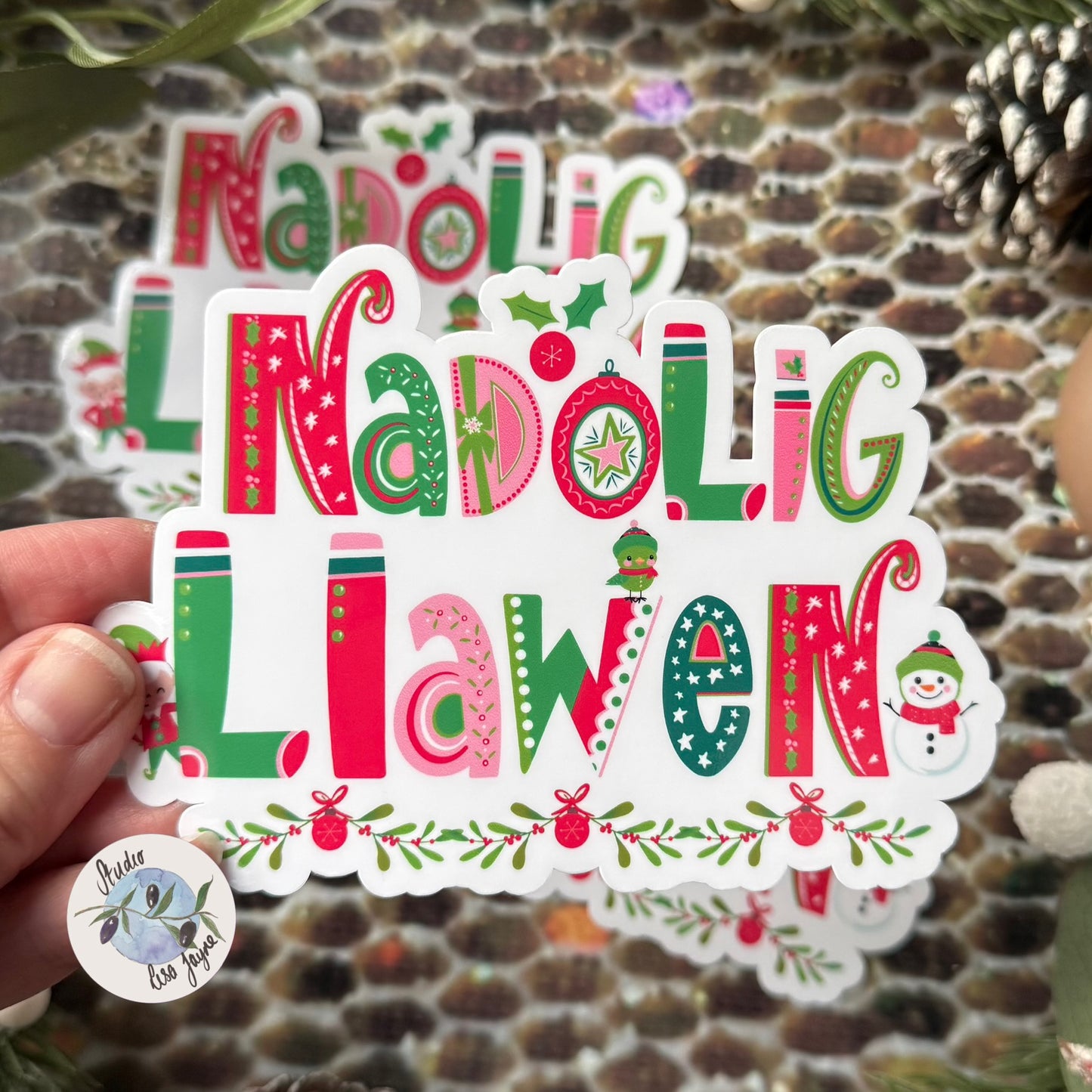 Nadolig Llawen Merry Christmas Welsh Cymraeg Vinyl Sticker - Waterproof Decal - Close up in hand