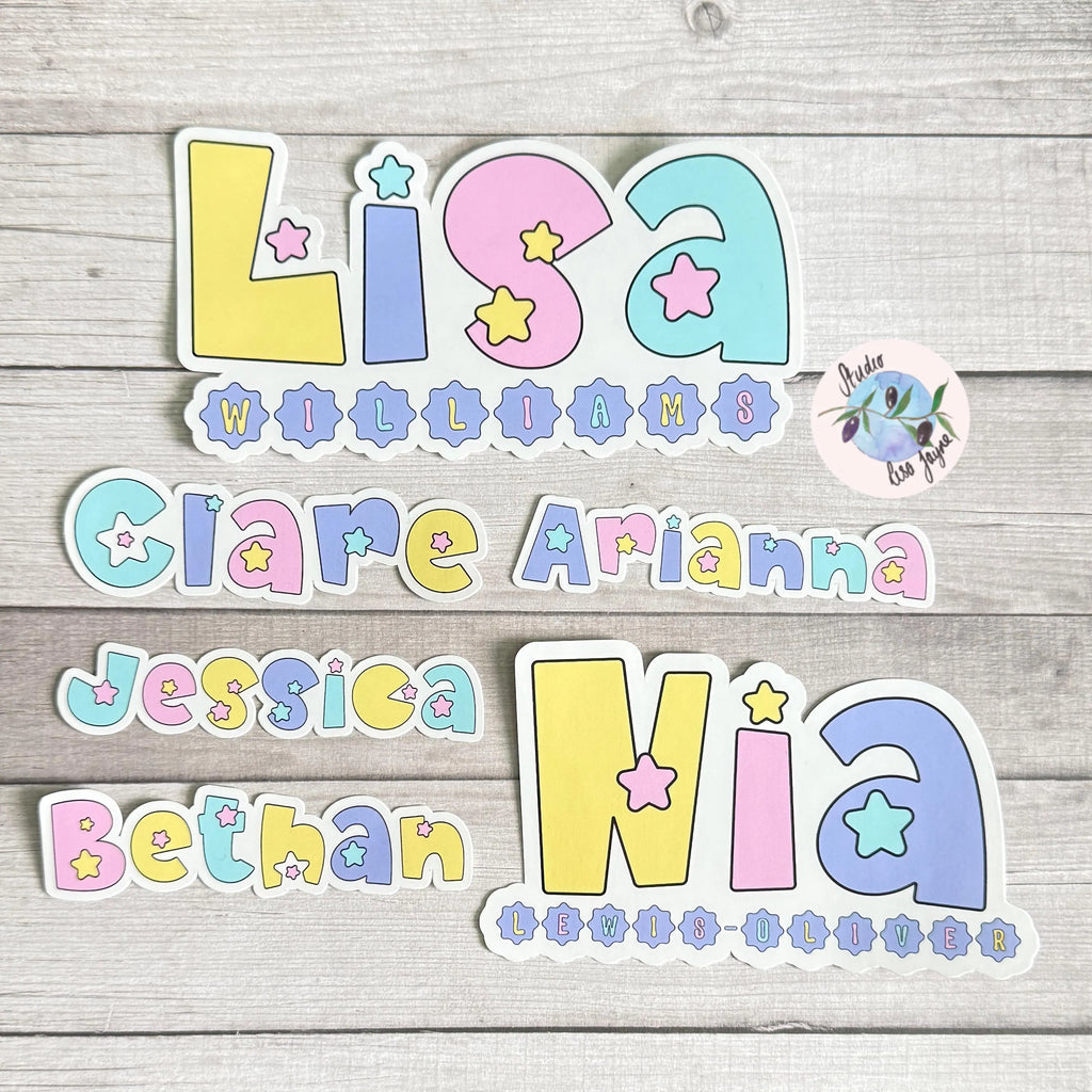Colorful pastel star name stickers on a wooden surface