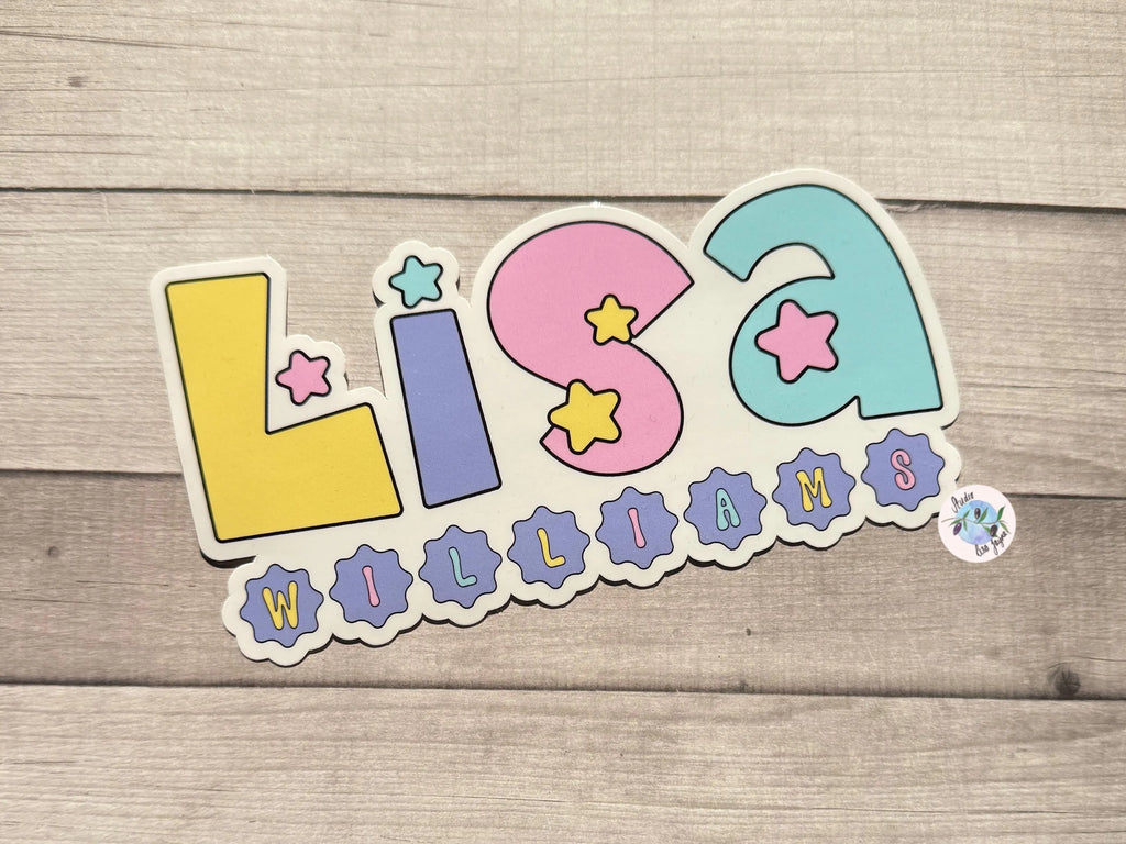 Colorful name sticker with 'Lisa Williams' on a wooden background