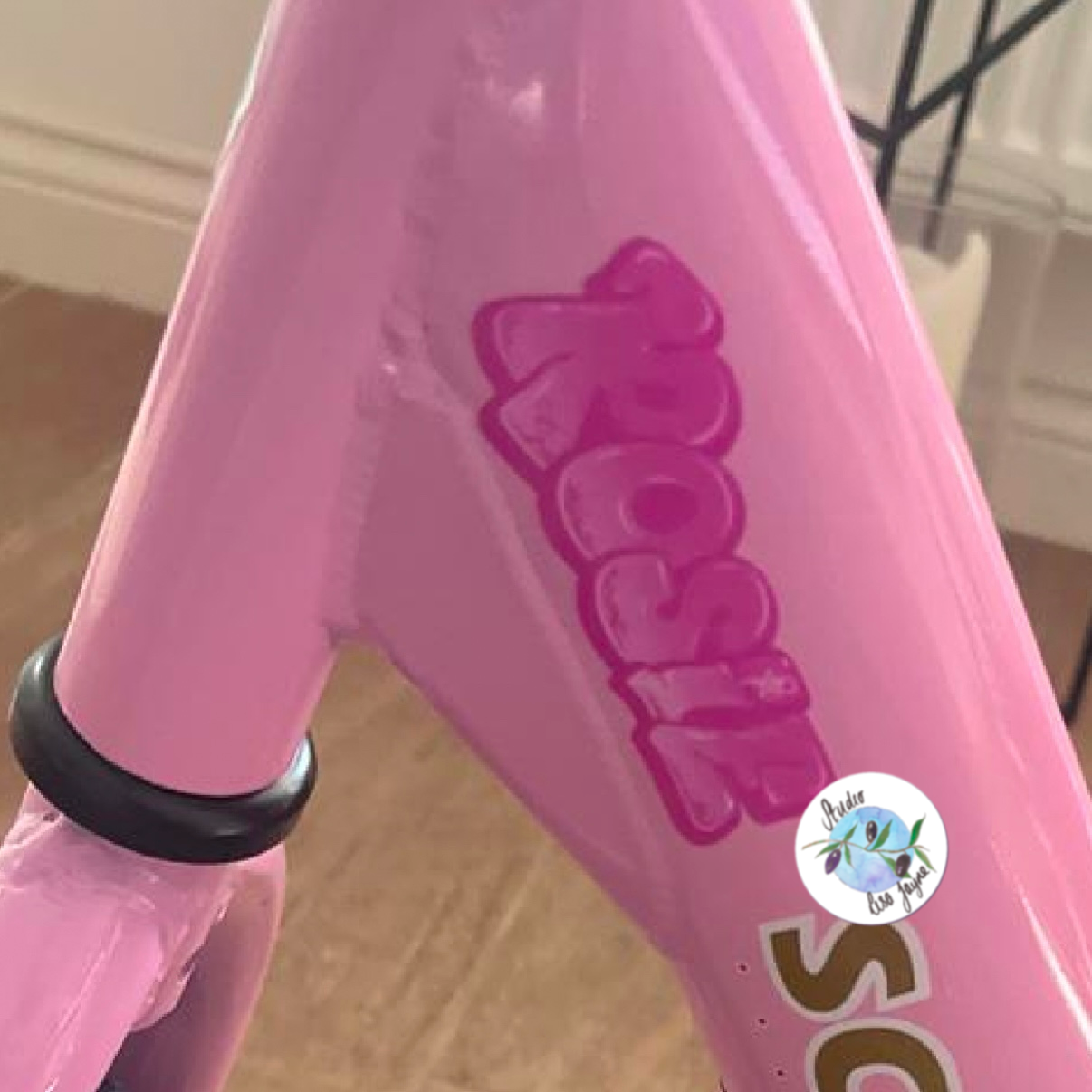 Pink kids name sticker - pinky graffiti style.  Ideal for girl school labels.  Applied to a little girl’s pink trike 